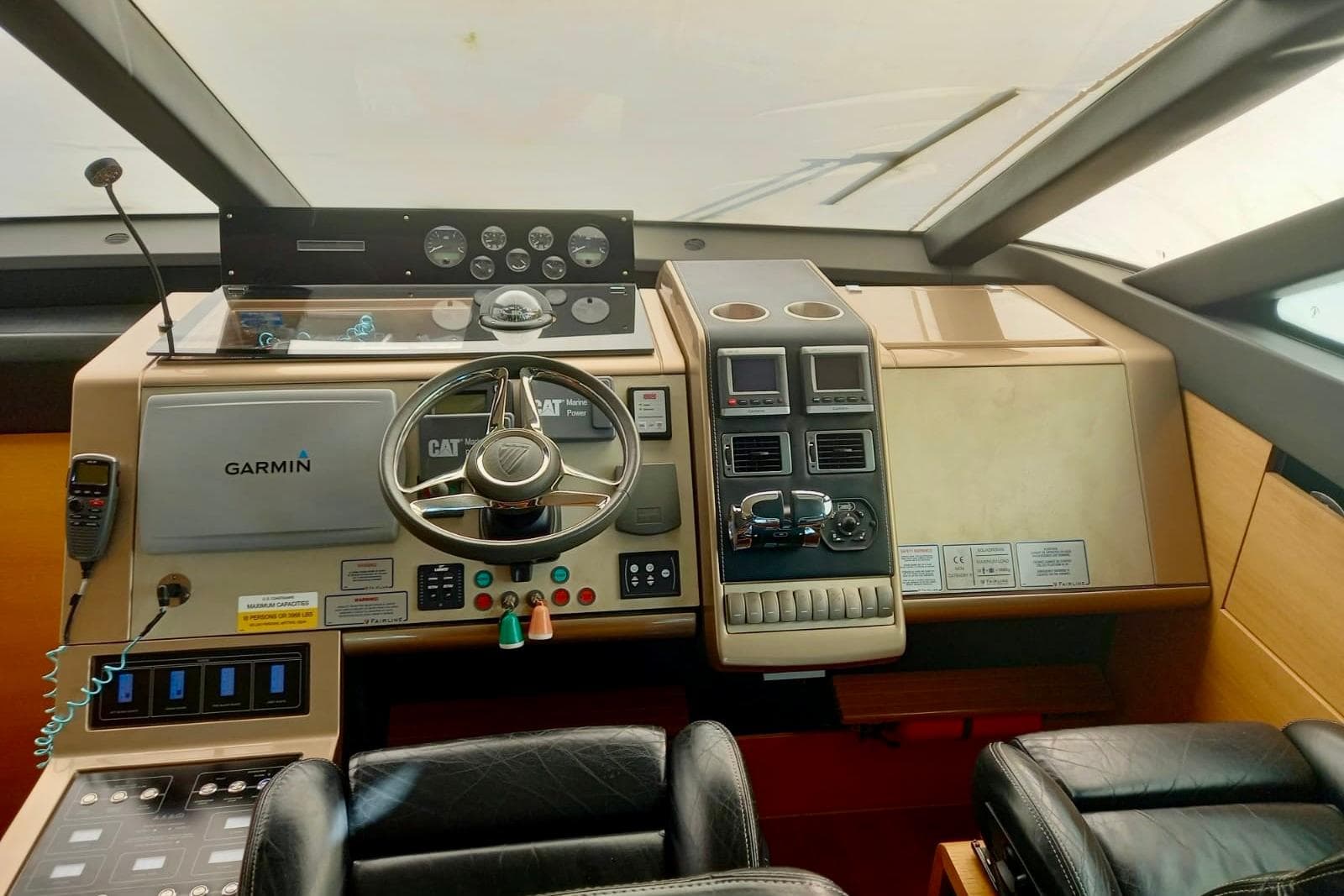 Cockpit of 2012 Fairline Squadron 65 yacht with Garmin navigation system.