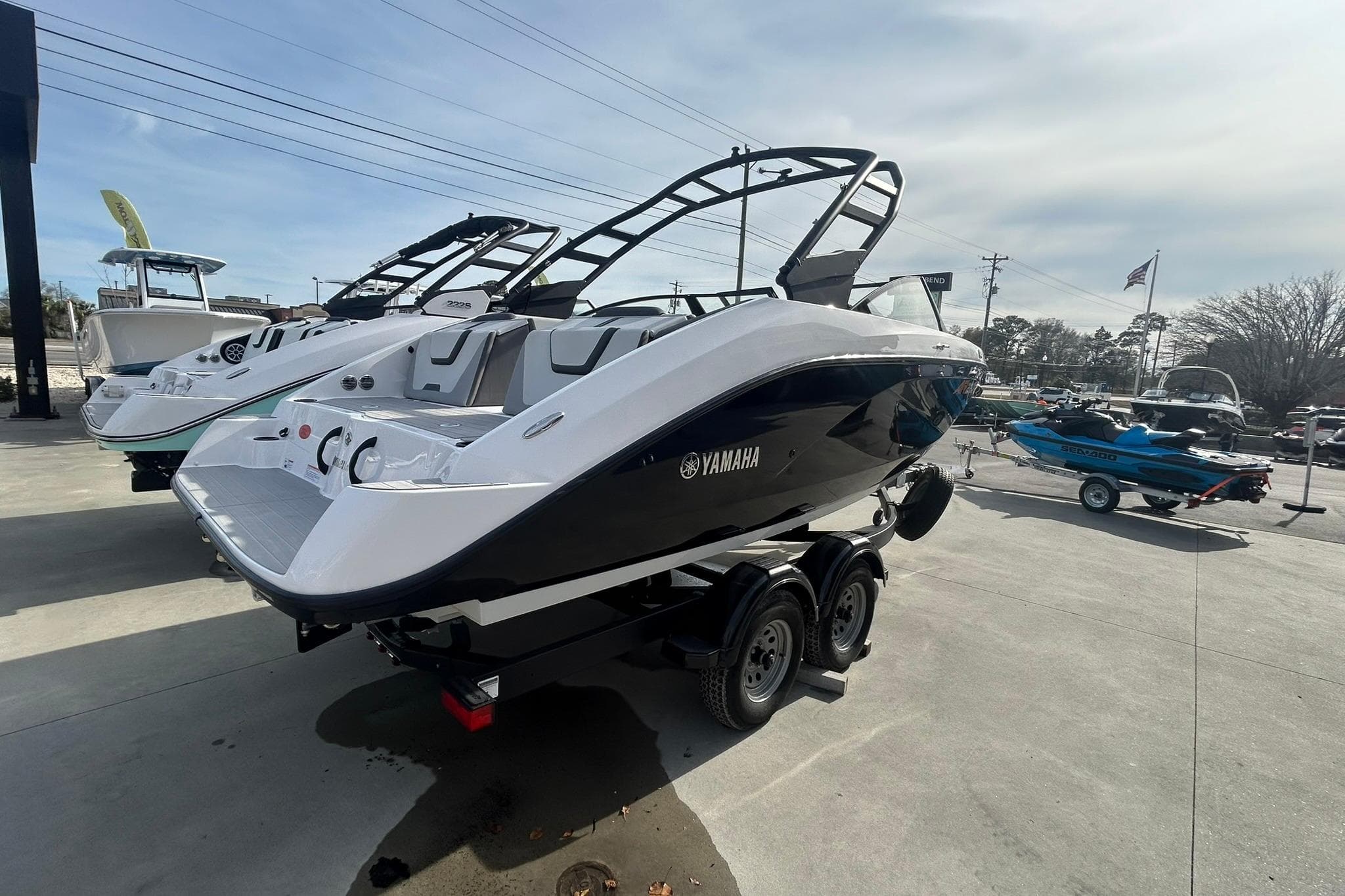 2024 Yamaha Boats AR220 displayed outdoors on a trailer, showcasing sleek design and modern features.