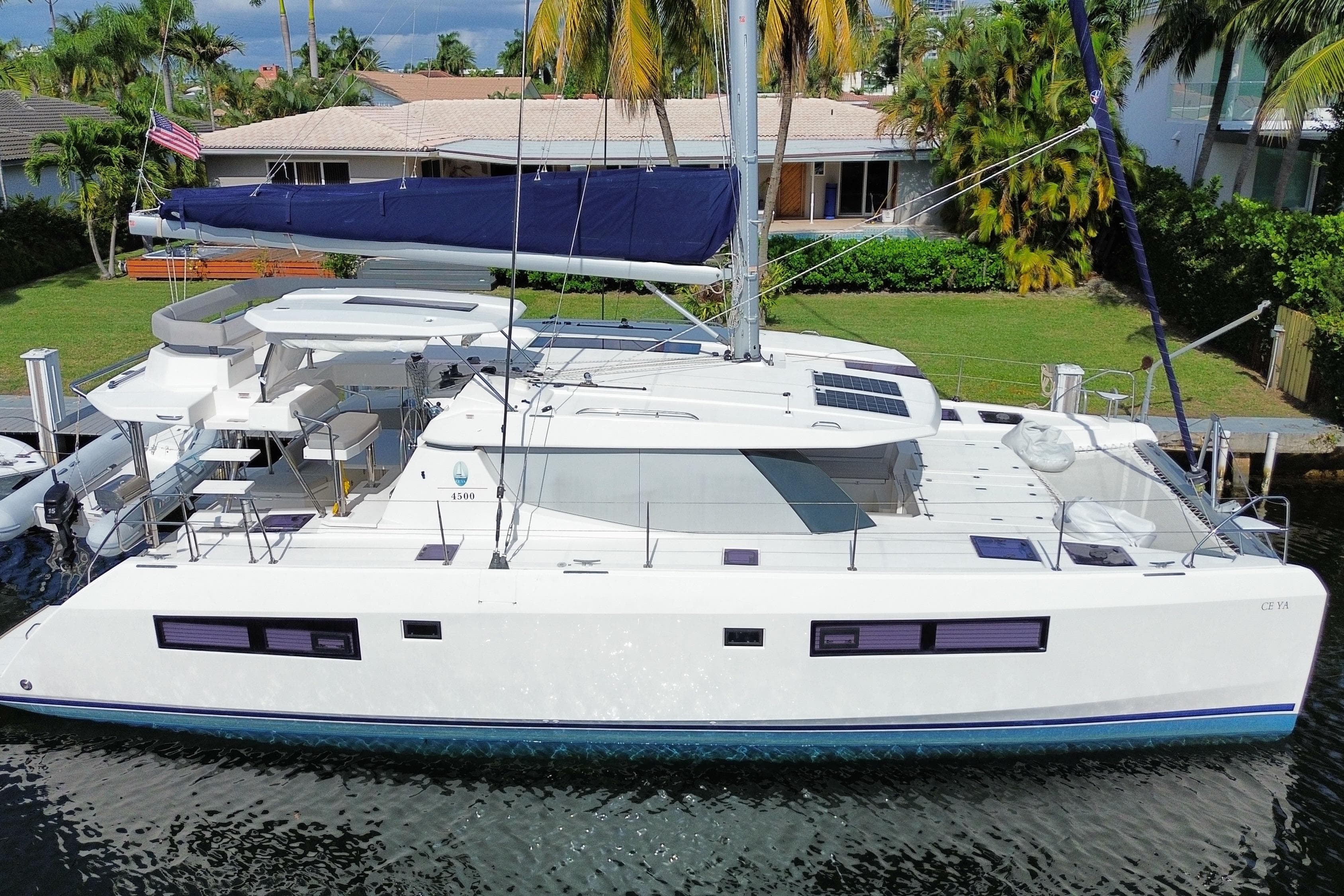 2021 Leopard 45 catamaran docked, featuring sleek design and spacious deck.