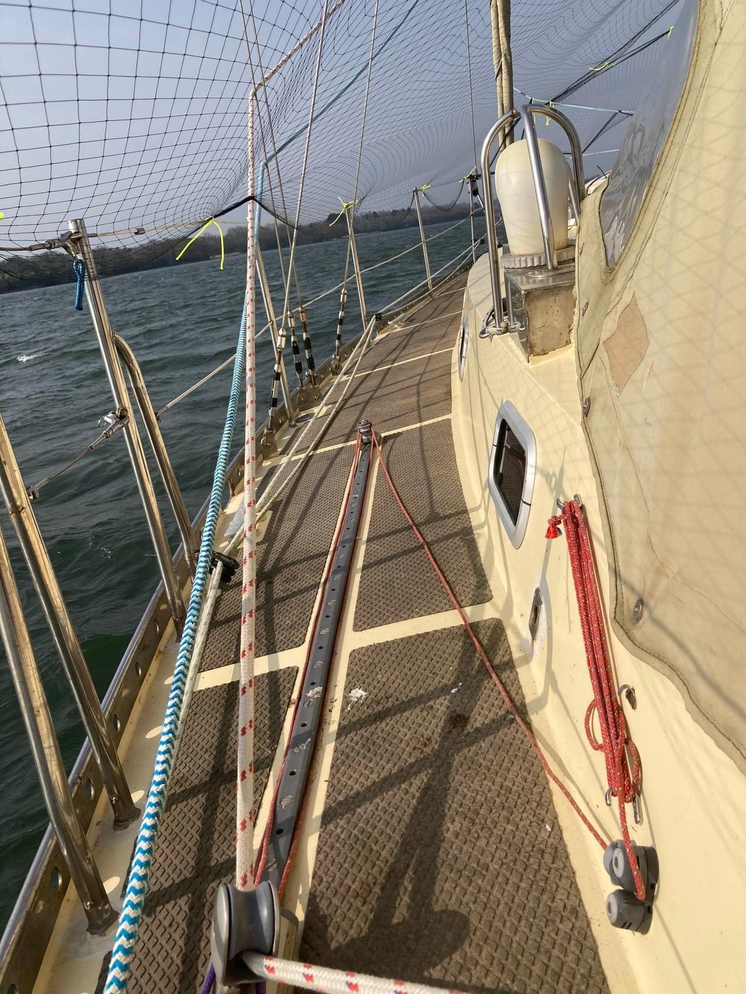 2014 Bruce Roberts Spray A370 sailboat deck with safety netting and ropes.