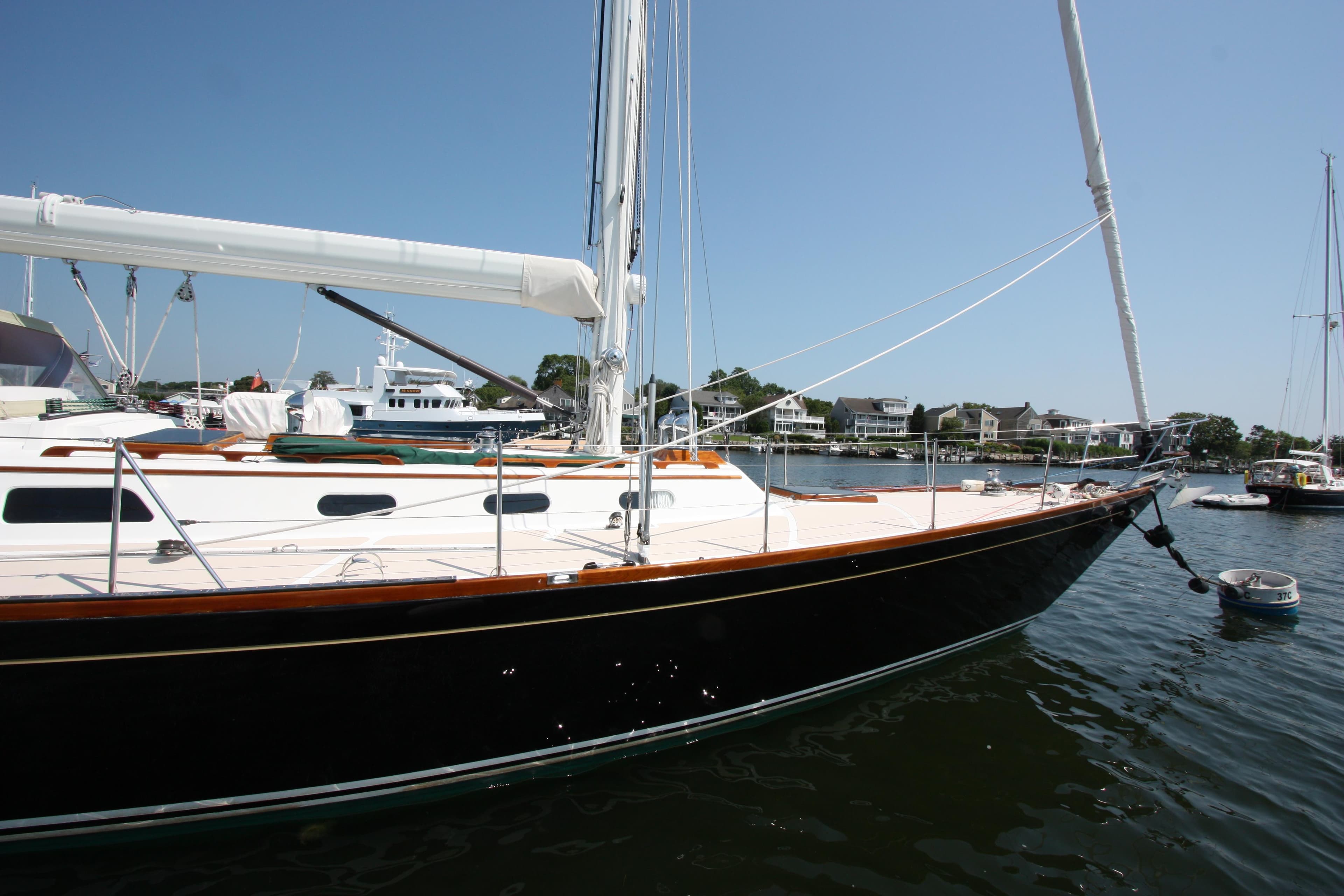 Hinckley Sou'wester 51 sailboat, 1993 model, docked in a sunny marina.