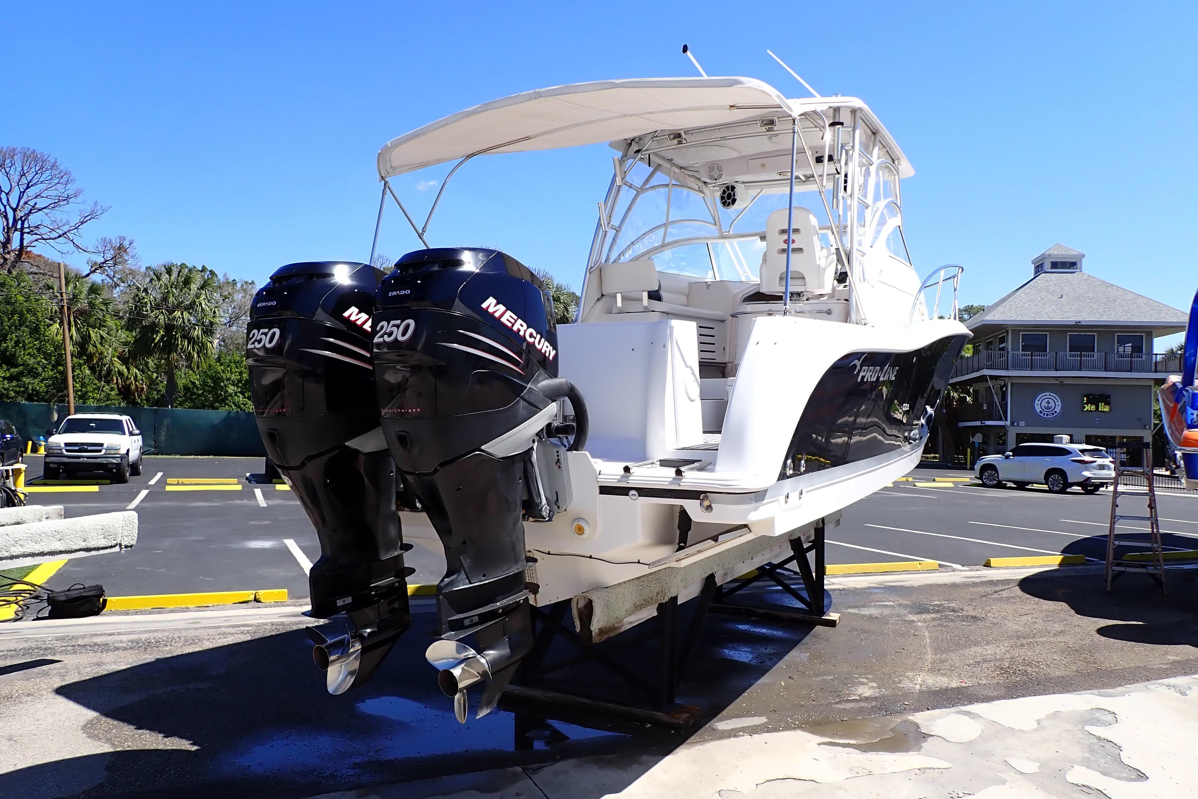 2014 Pro-Line 32 Express boat with twin Mercury 250 engines on a trailer.