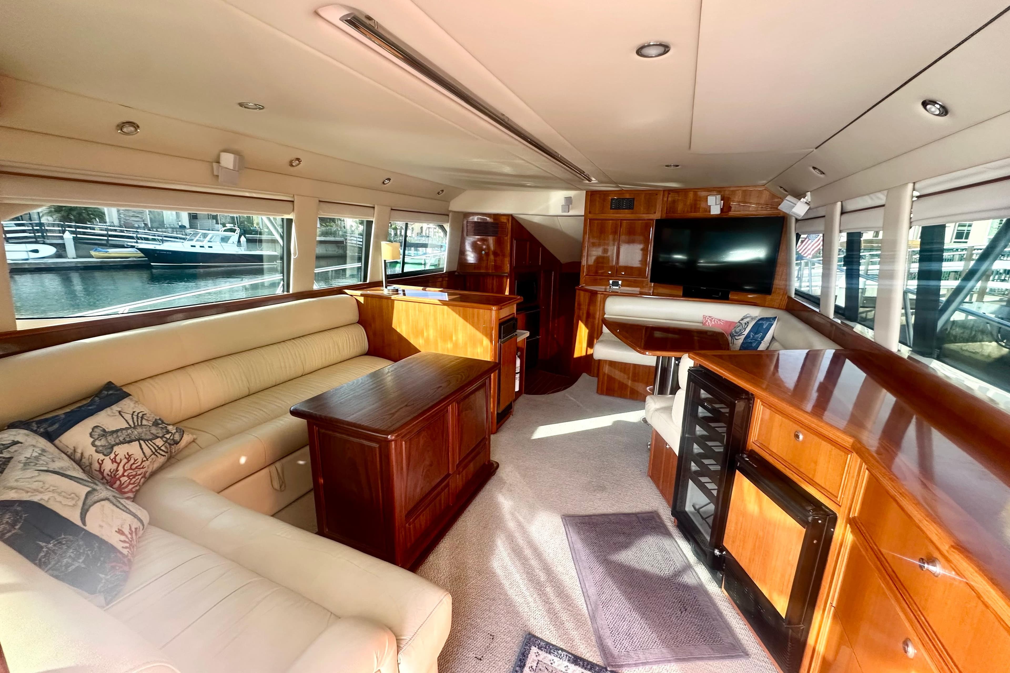 Luxurious interior of a 2007 Riviera Sport Fisherman yacht with elegant wood finishes.