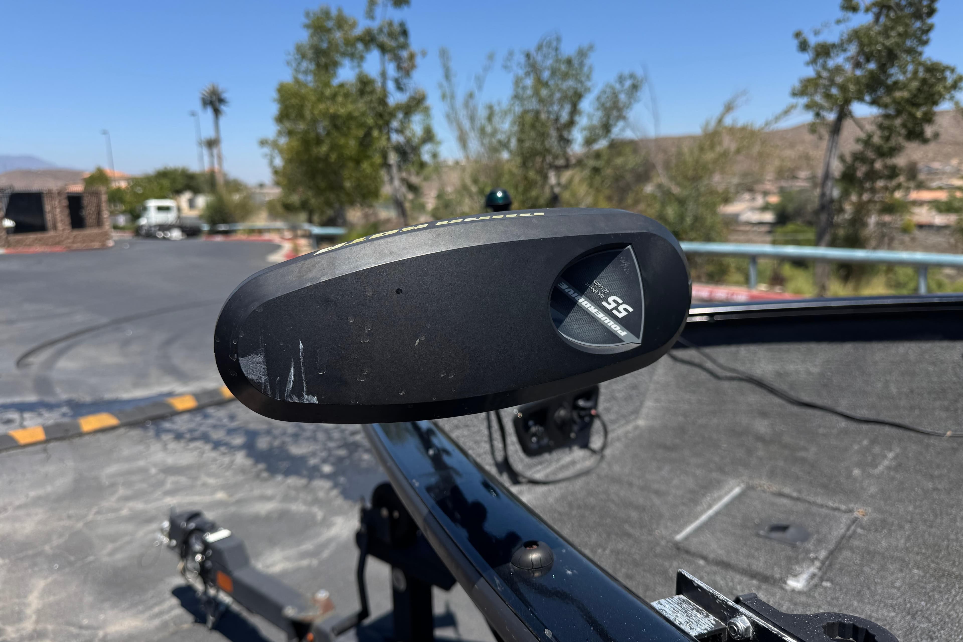 2017 Tracker Pro Guide V-175 Combo boat detail with trolling motor in parking lot.