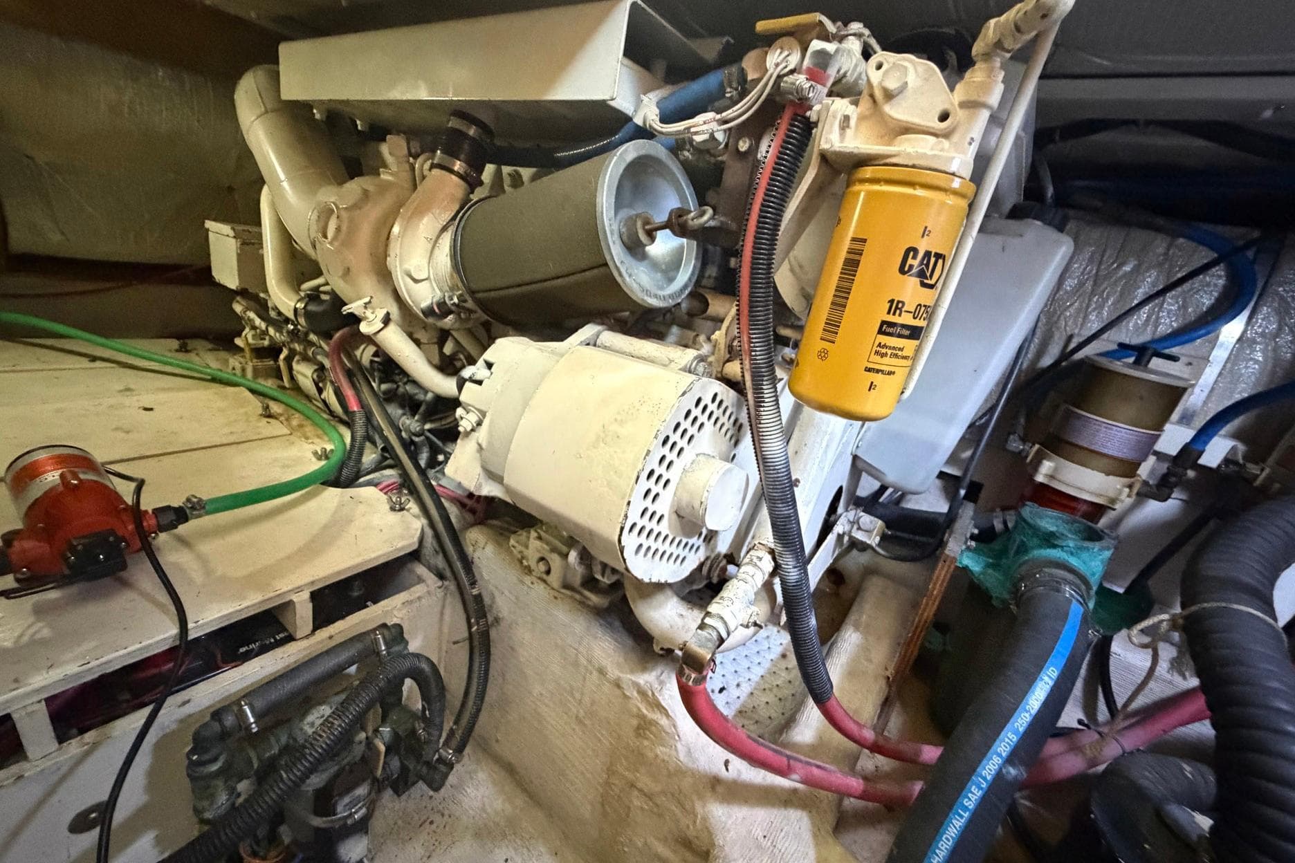 Engine room of a 1997 Sabreline 36 Express boat, showcasing mechanical components.