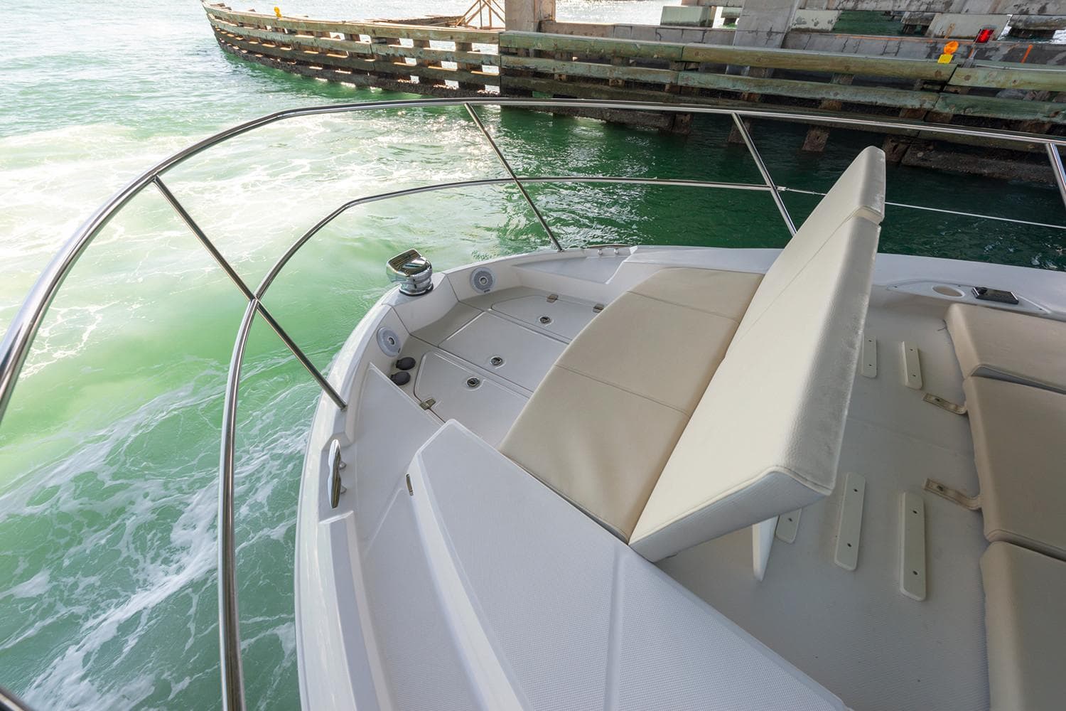 Manufacturer Provided Image: 2022 Regal 38 Grande Coupe bow seating area with water view.