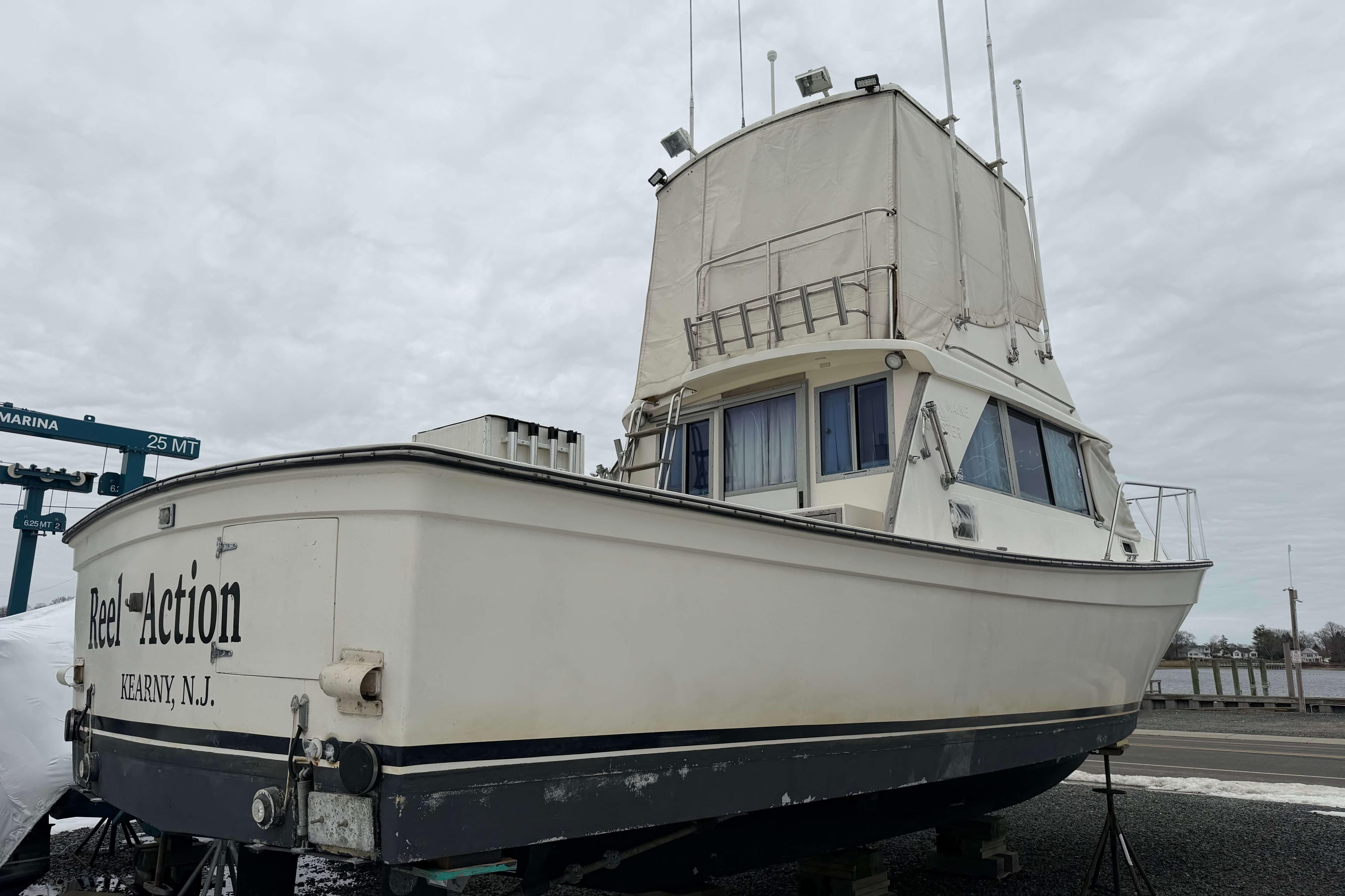 1986 Henriques Yachts 35 Maine Coaster, docked, with "Reel Action" text, Kearny, N.J.