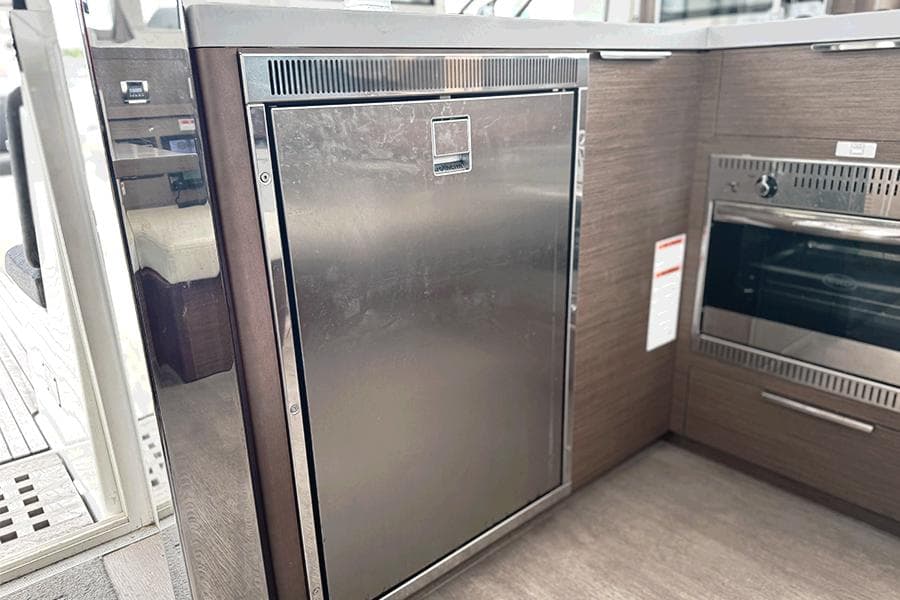 Modern kitchen area in a 2019 Lagoon 40 yacht with stainless steel appliances.