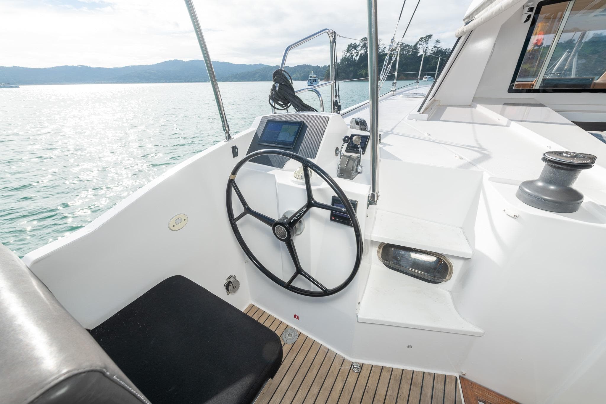 Helm of 2015 Nautitech 40 Open catamaran with scenic ocean view.