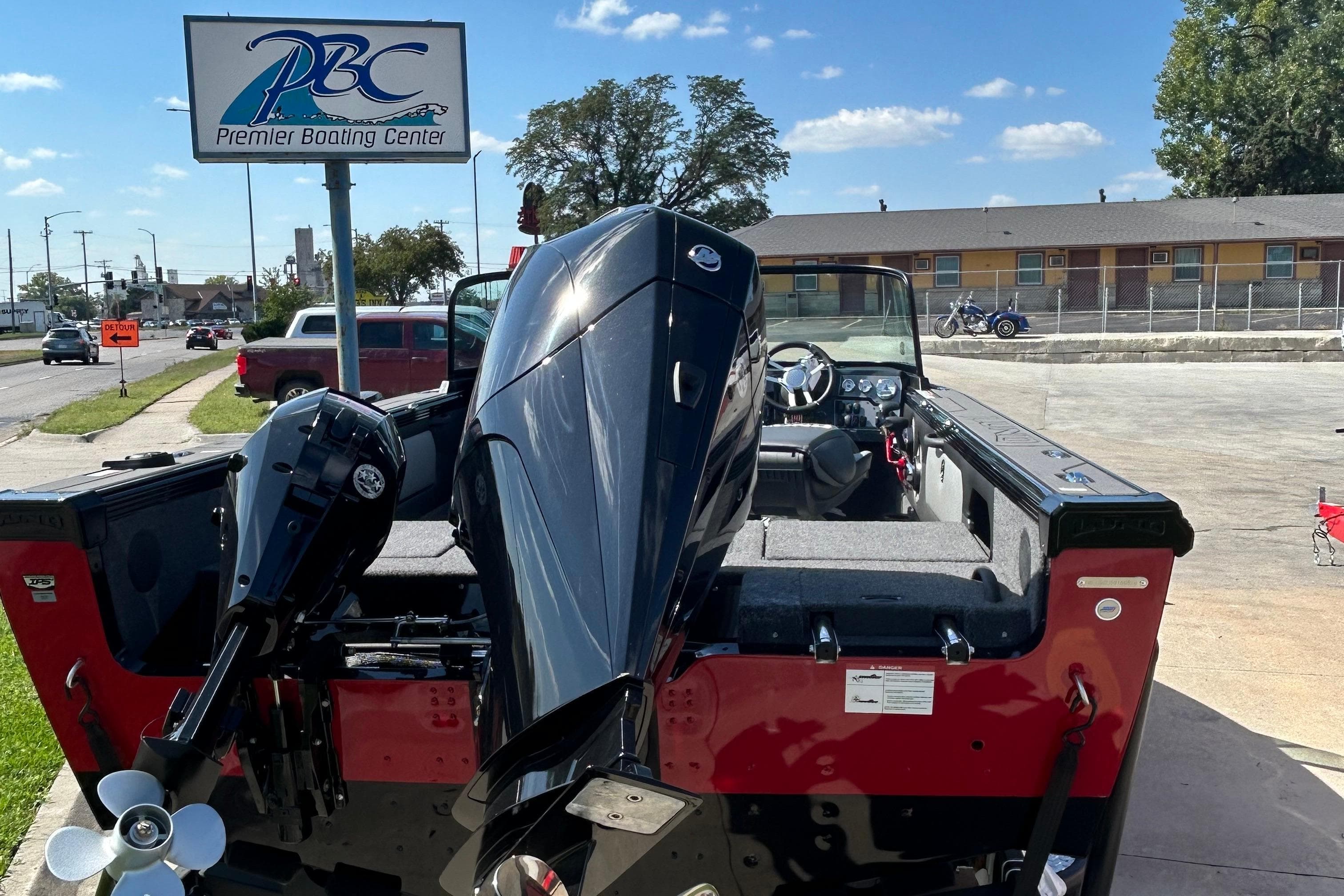 2026 Lund 1875 Tyee boat at Premier Boating Center, featuring powerful outboard motor.