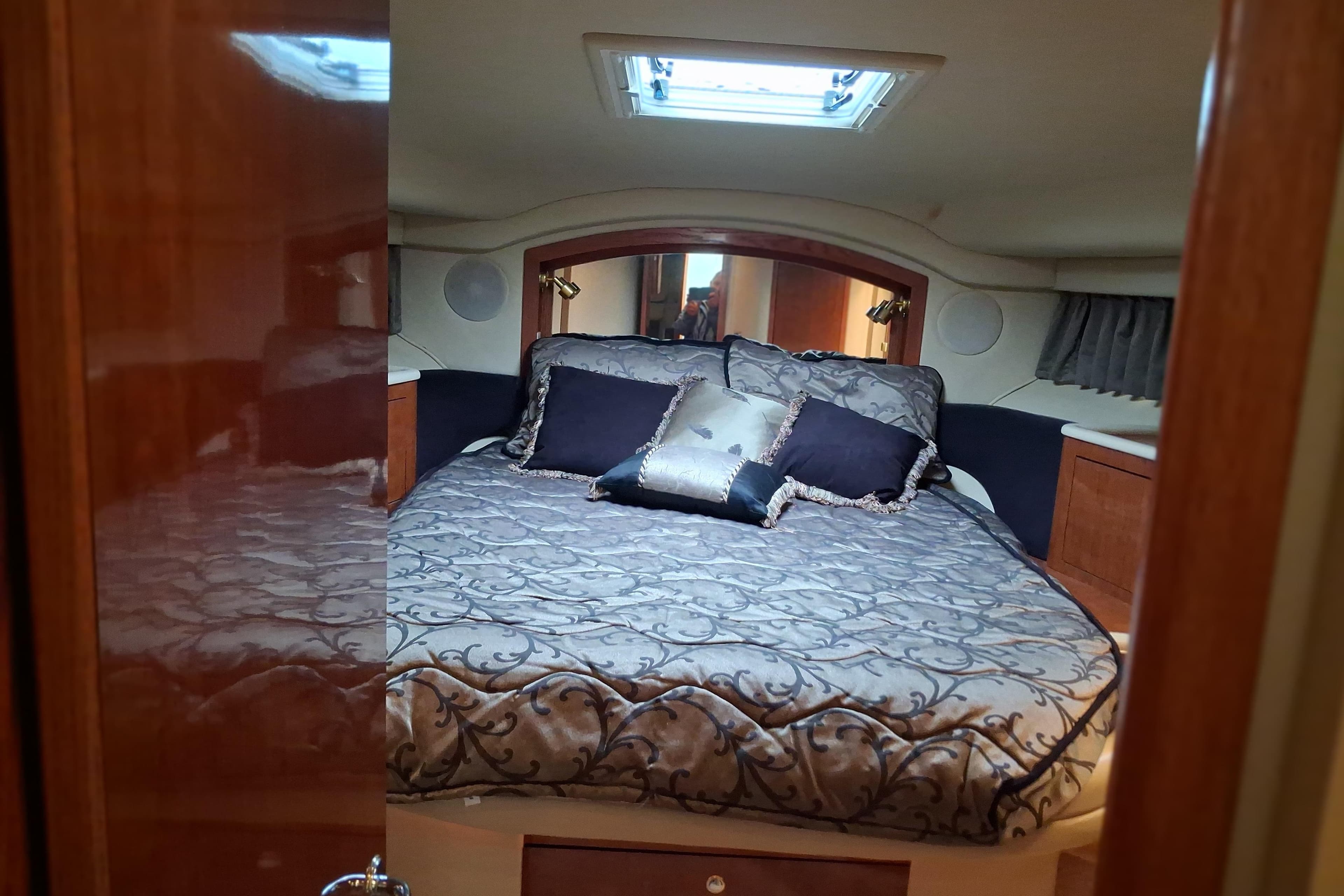 Luxurious bedroom interior of 2003 Sea Ray 400 Sedan Bridge yacht.