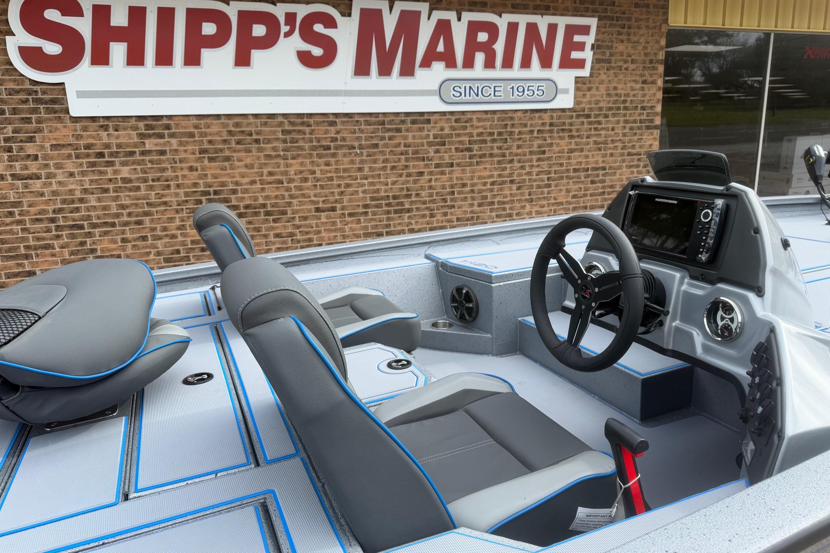 2026 Xpress H20 boat interior with steering wheel and navigation system at Shipp's Marine.