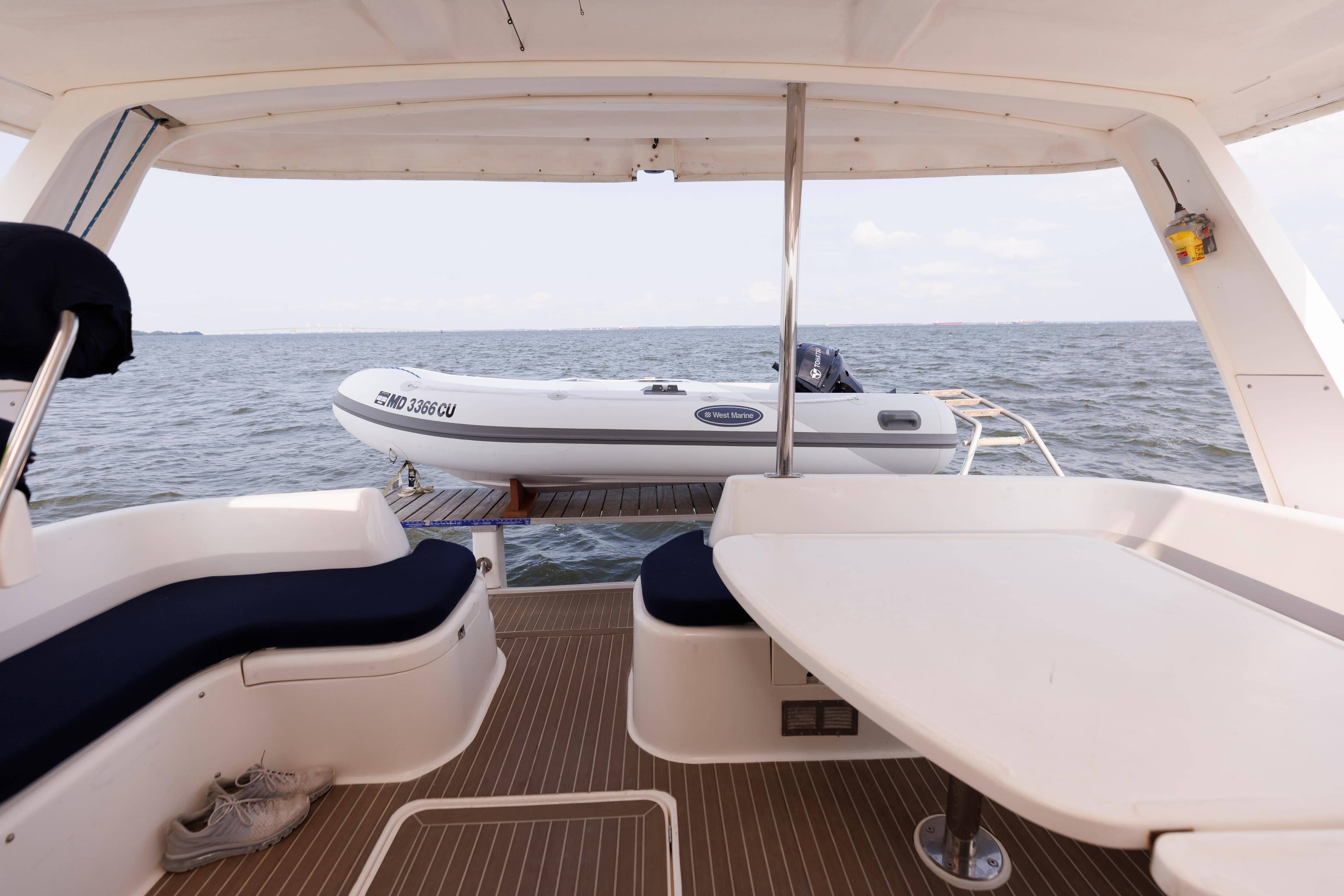 Leopard 43 yacht interior with ocean view and inflatable boat, 2006 model.