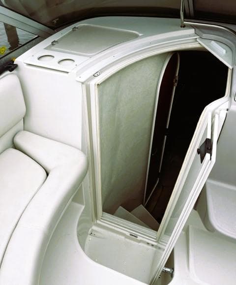 2001 Regal 2960 Commodore Cruiser interior cabin entrance with white seating.