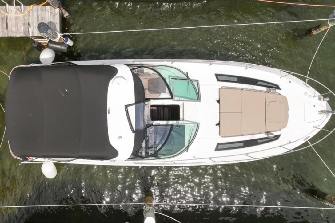 Overhead view of 2015 Sea Ray Sundancer 350 yacht docked in calm waters.