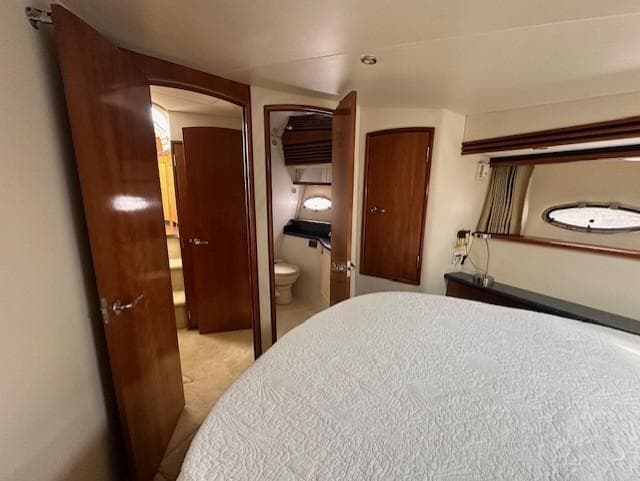 Interior of 2000 Carver 450 Voyager Pilothouse with bedroom and bathroom.