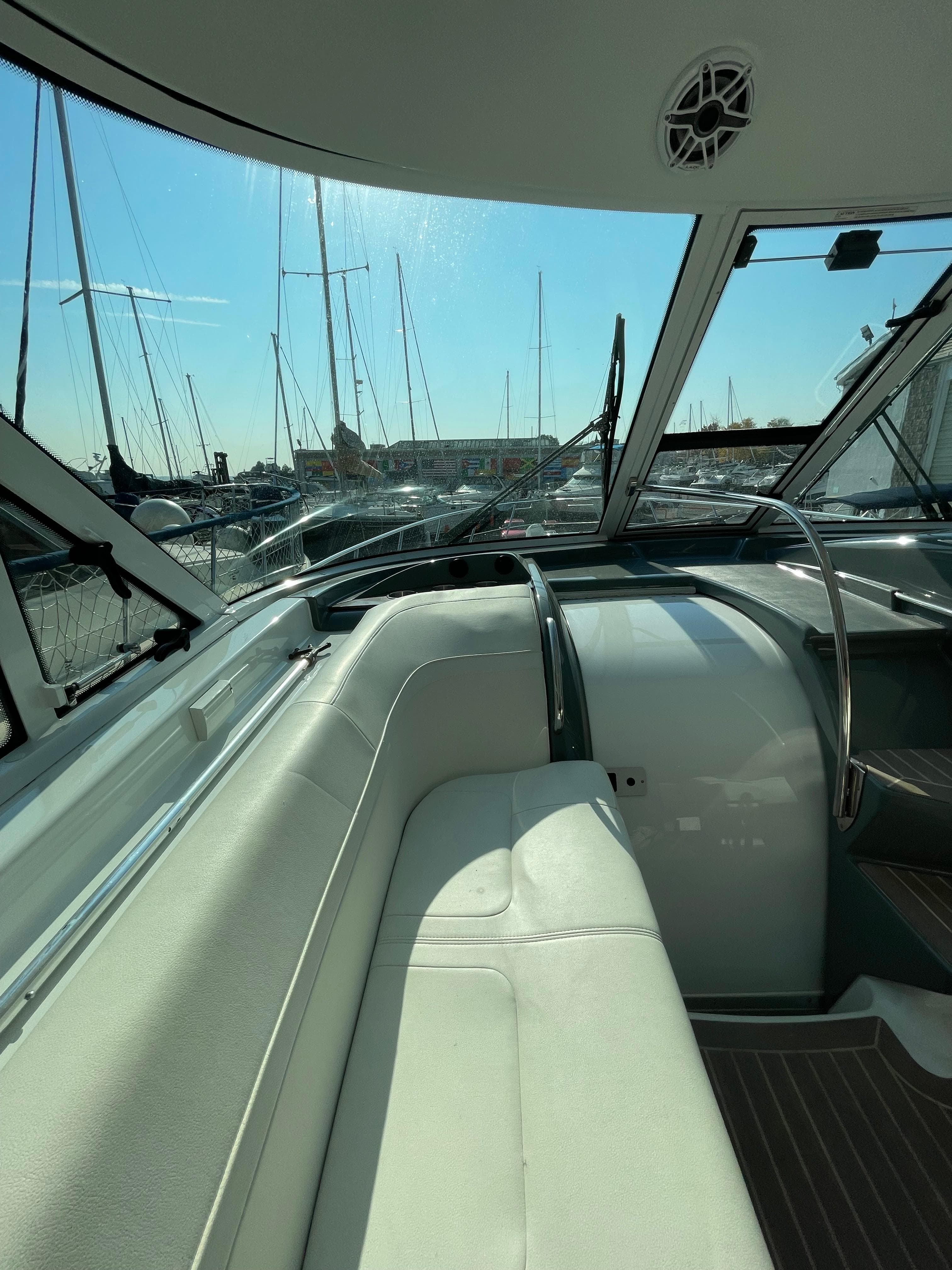 2014 Formula 45 Yacht interior with marina view, featuring sleek seating and modern design.