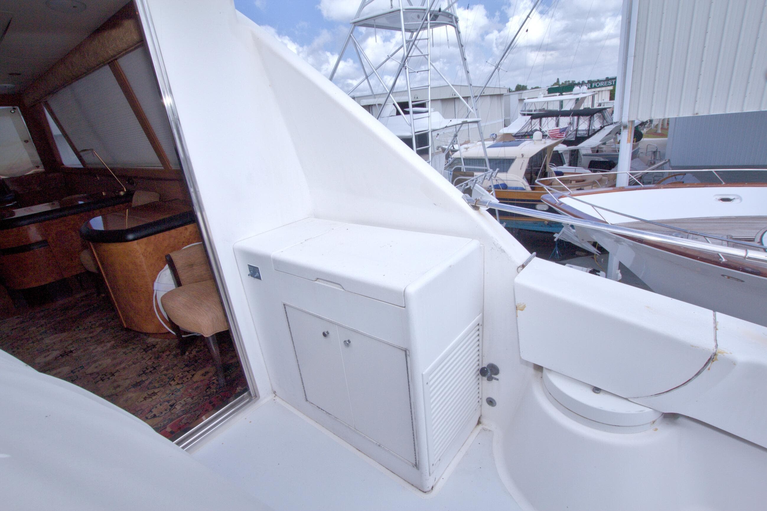 1998 Lazzara 76 Skylounge Grand Salon yacht interior and exterior view at marina.
