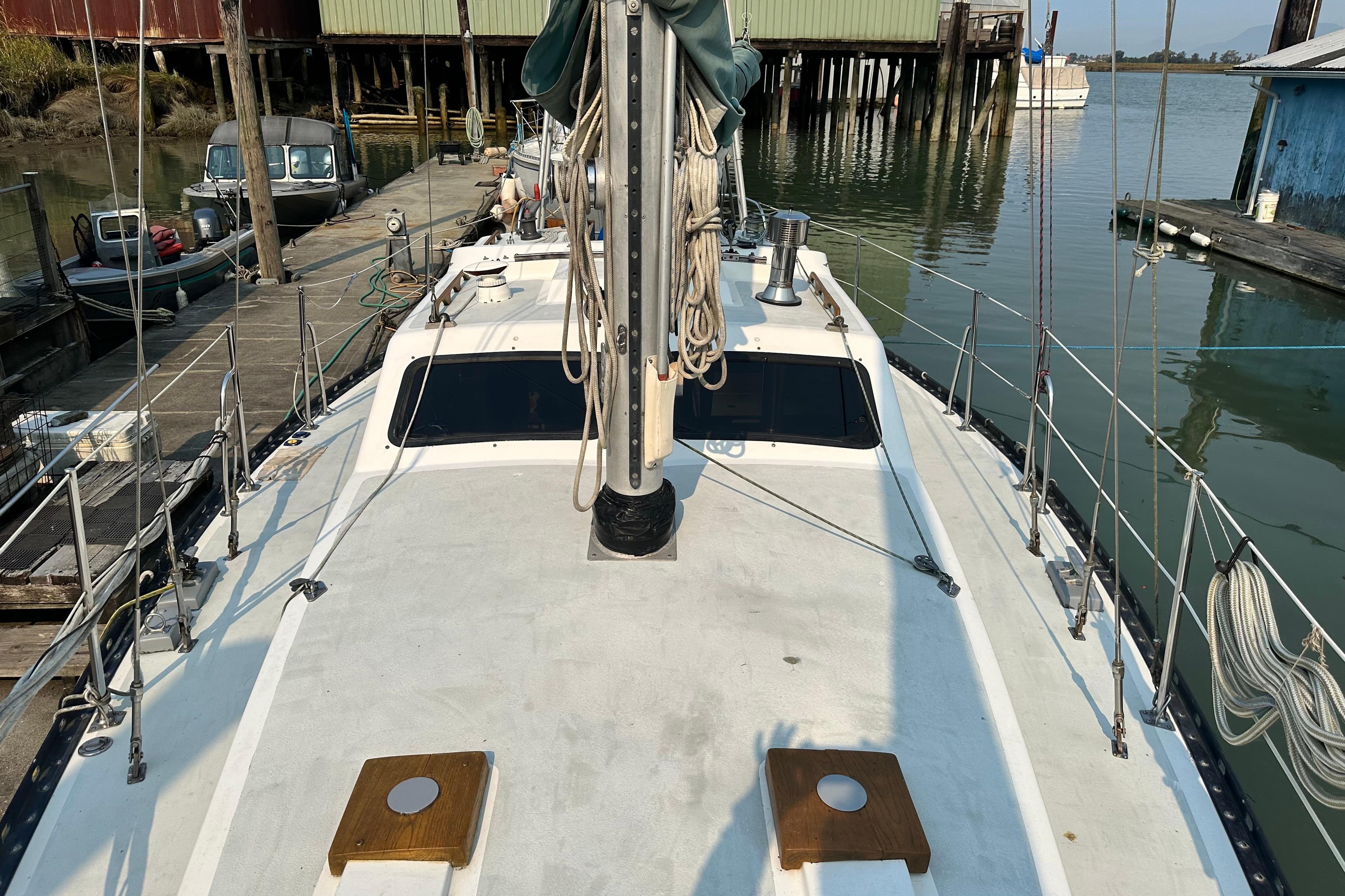 1981 Cooper 353 sailboat docked at a marina, showing deck and mast details.