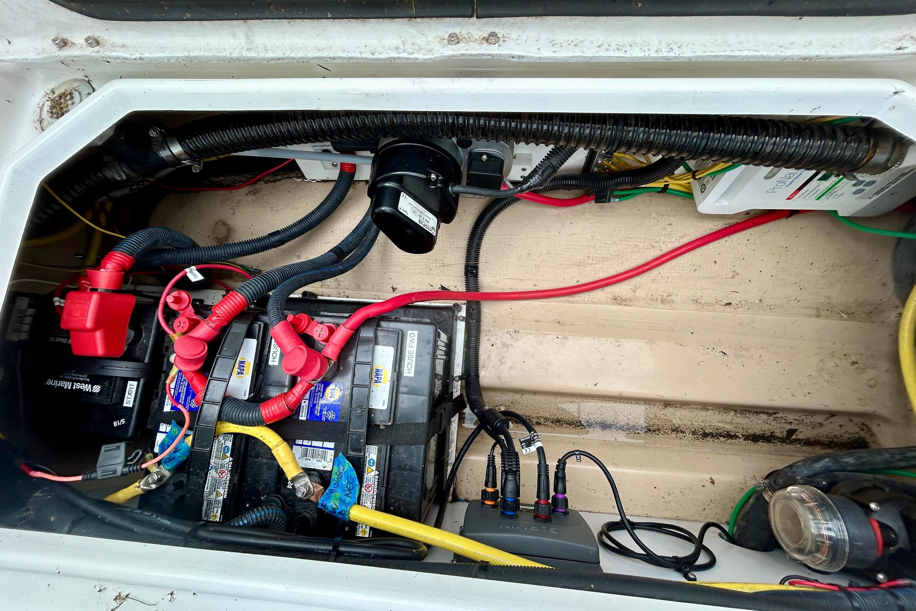 Electrical system of a 2016 Cutwater C-24 boat, featuring batteries and wiring.