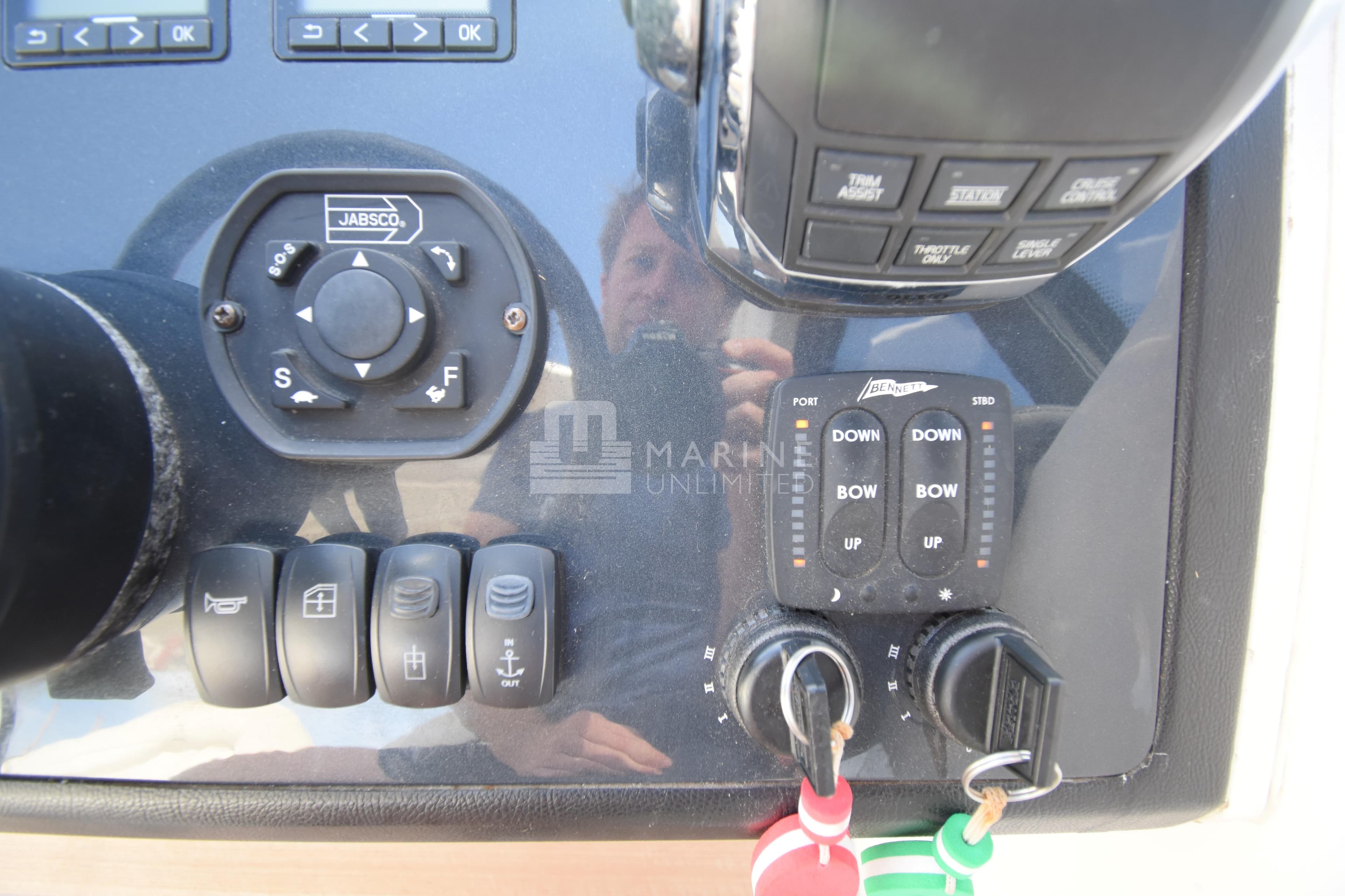 Control panel of a 2012 Princess V42 yacht with various switches and keys.