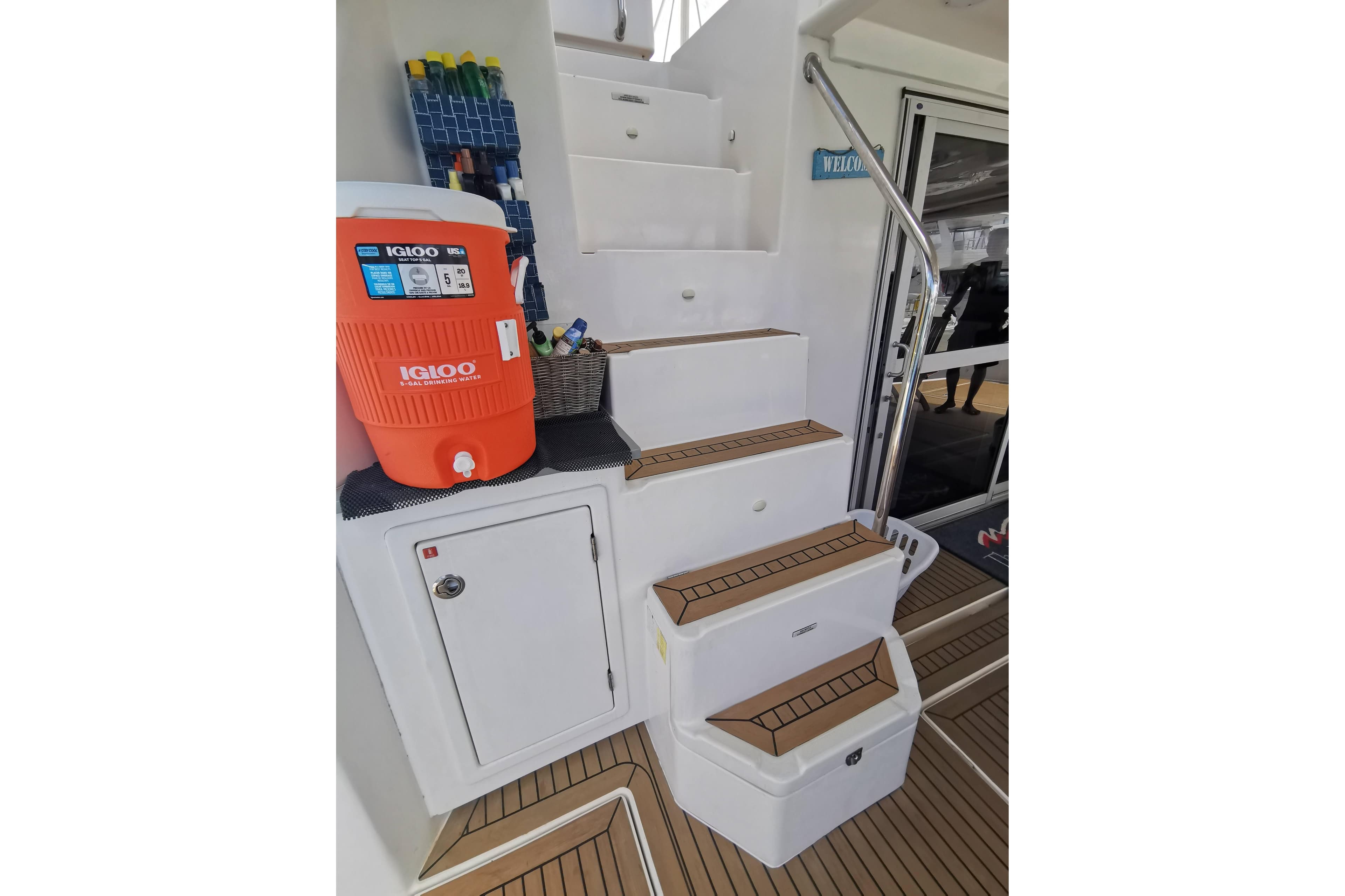 Staircase on Leopard 58 yacht with Igloo cooler and storage, 2020 model.