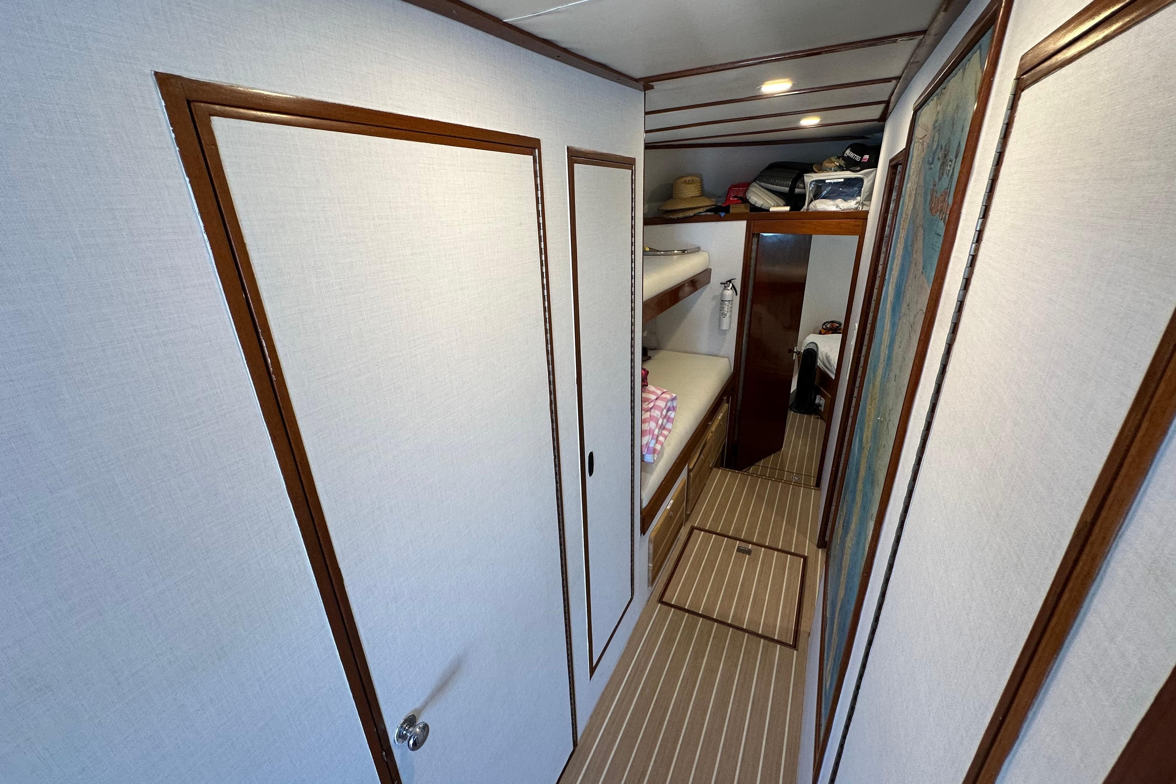 1973 Elliott Yachtfisher interior with bunk beds and wooden accents.