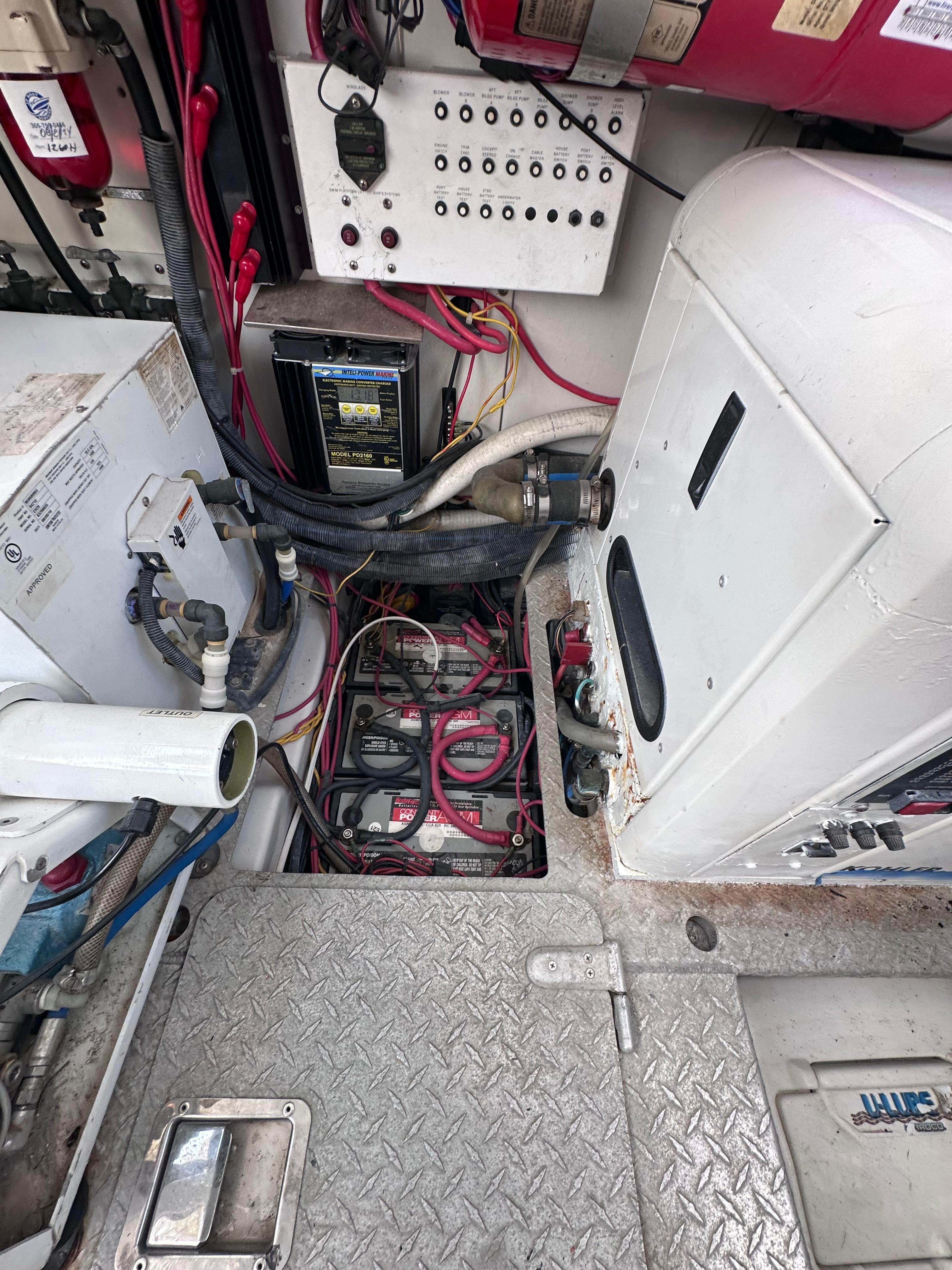 Engine compartment of a 2008 Four Winns V458 boat, showing wiring and equipment.