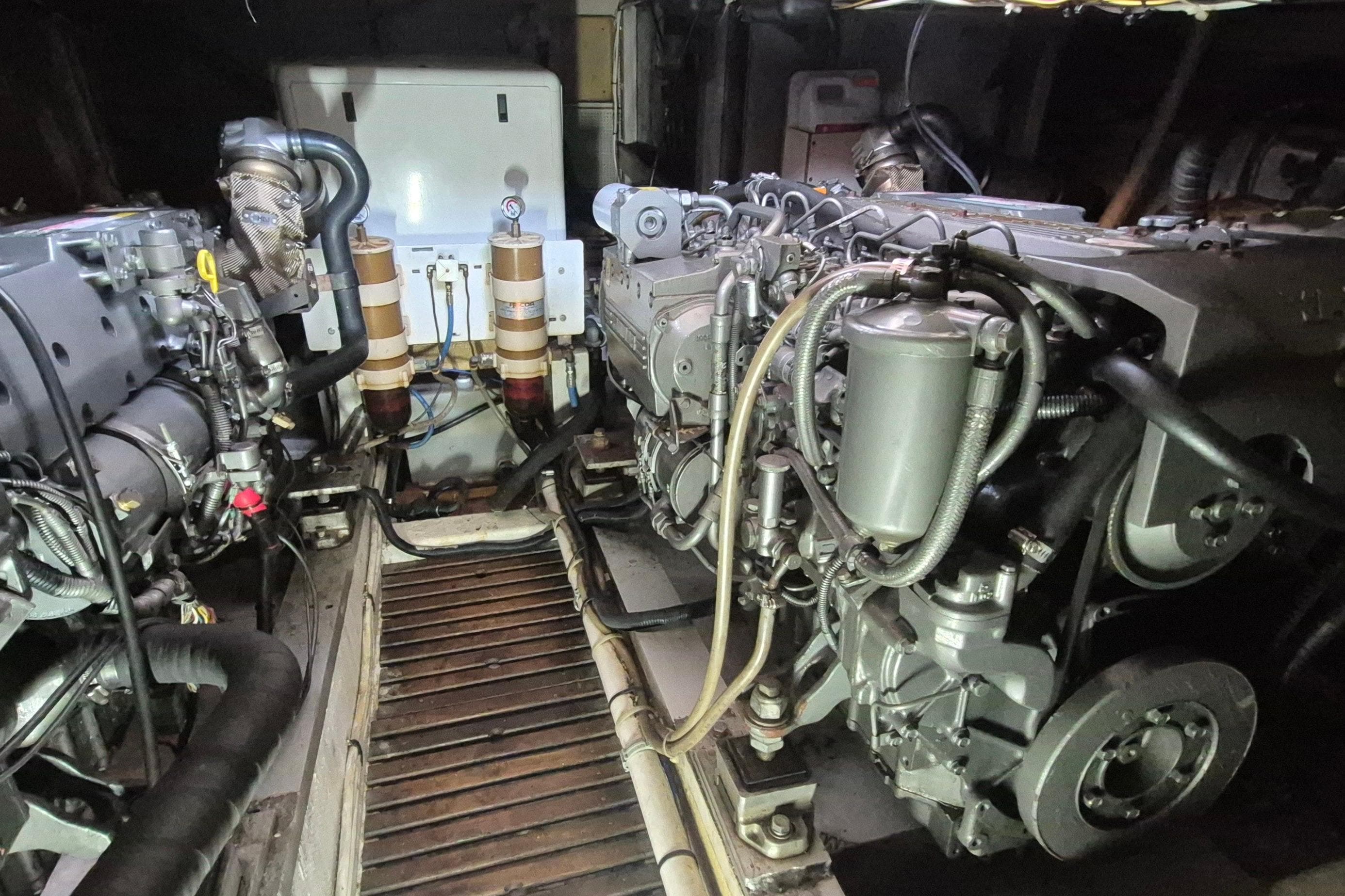 Engine room of a 1983 Grand Banks 42 Classic yacht, showcasing dual engines.