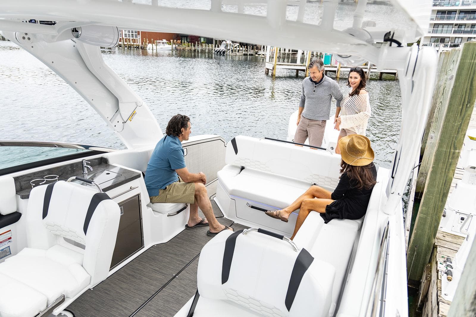 2025 Four Winns H9 boat with people enjoying a sunny day on the water.