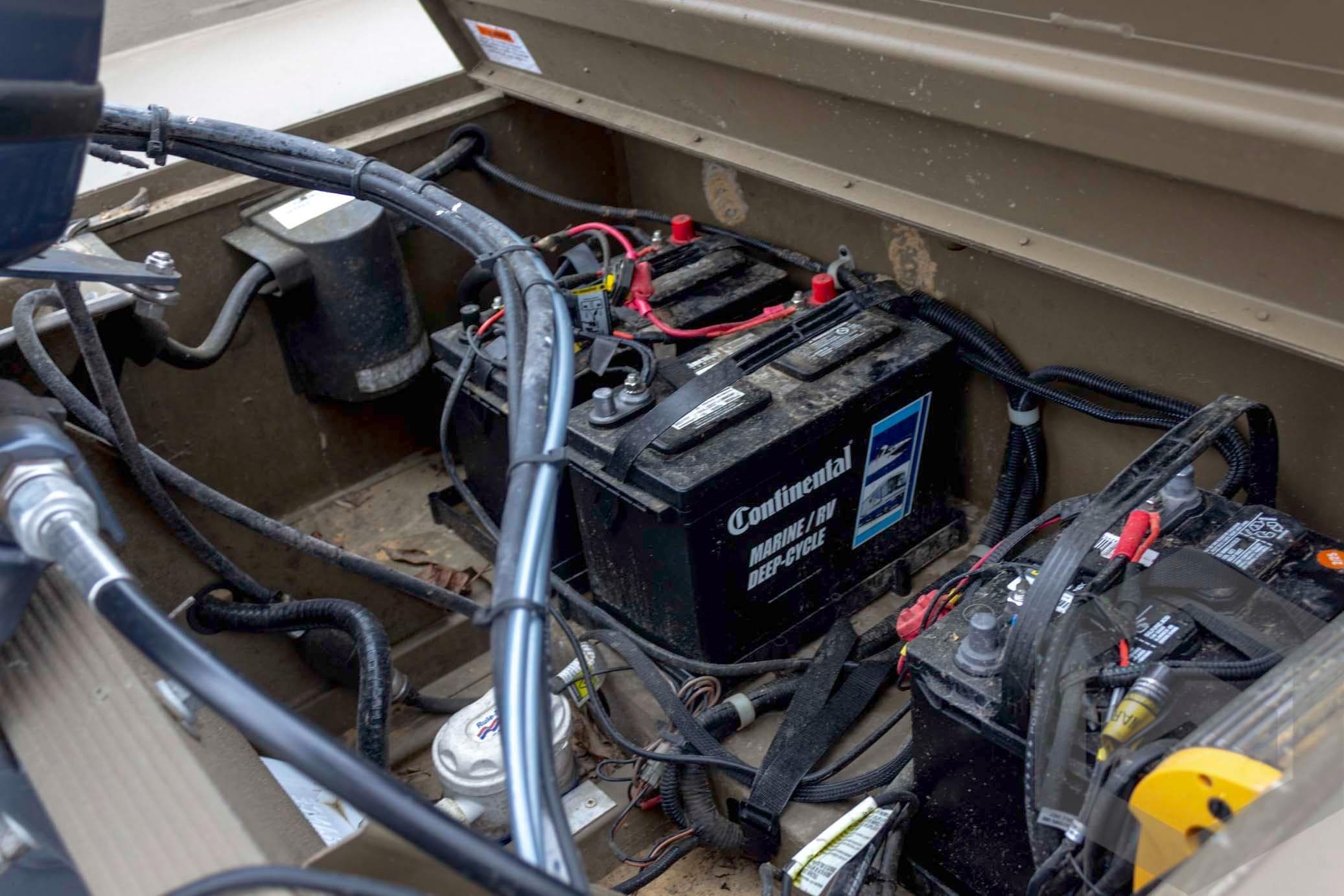2015 G3 1860 CC Deluxe boat battery compartment with wiring and marine batteries.