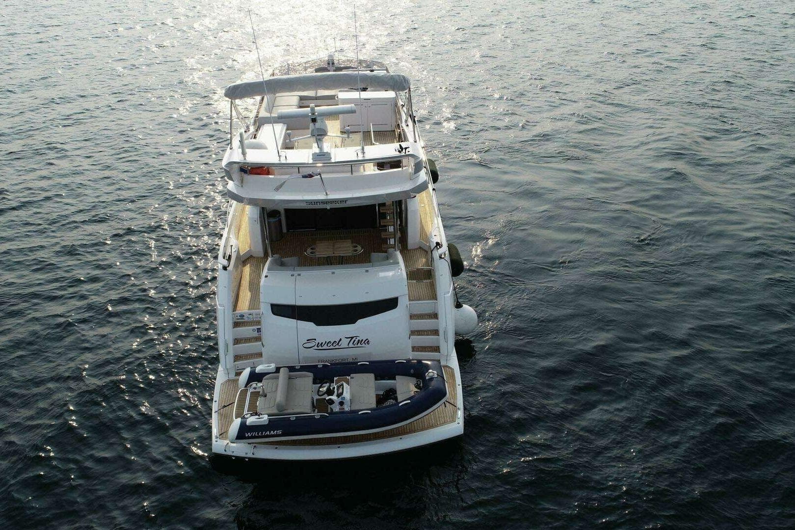 Sunseeker Manhattan 68 yacht cruising on open water, 2023 model.
