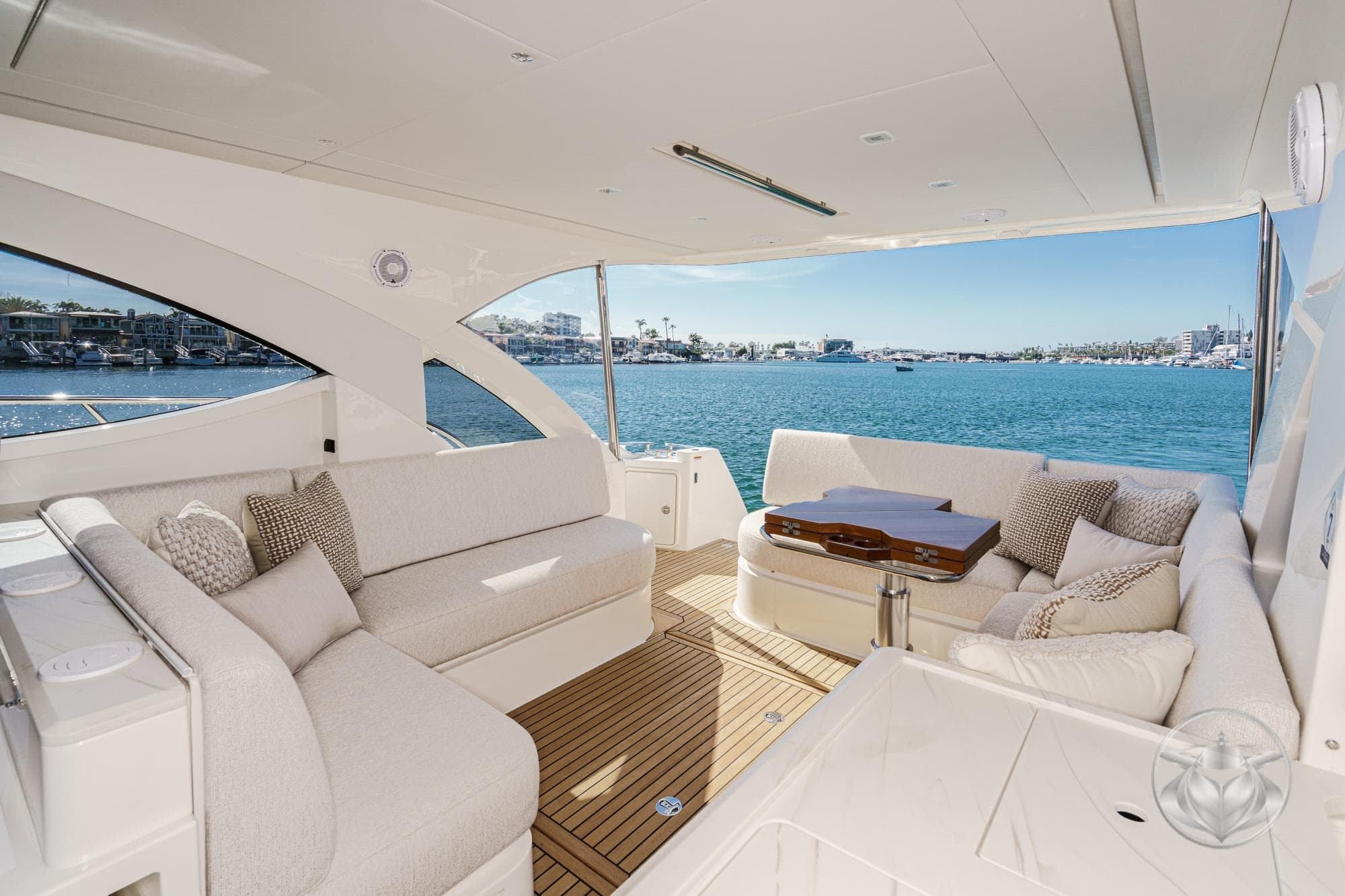 Luxurious 2026 Riviera 4300 Sport Express yacht interior with ocean view and elegant seating.