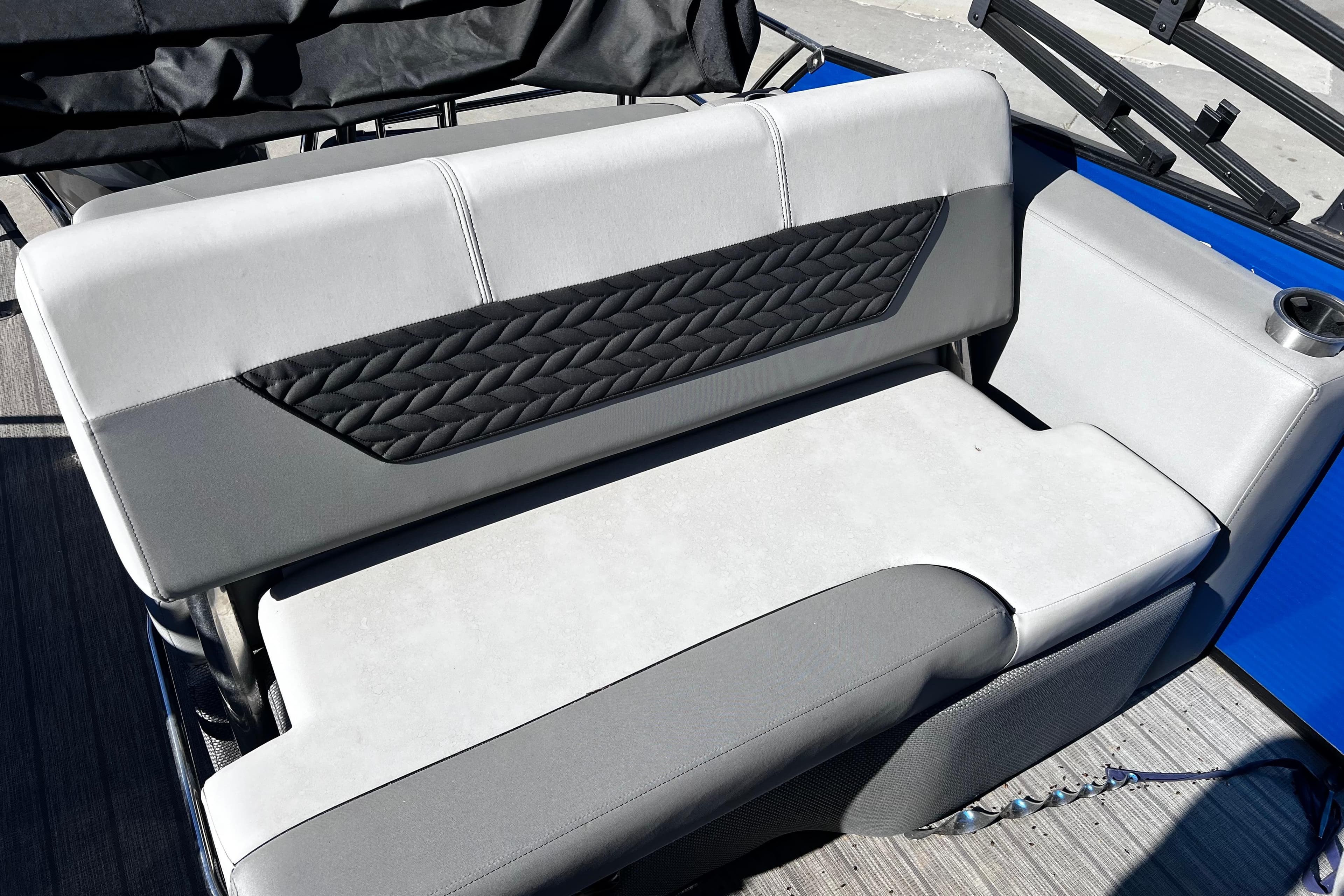 2022 Godfrey Monaco 235 SFL boat seat with quilted design and cup holder.