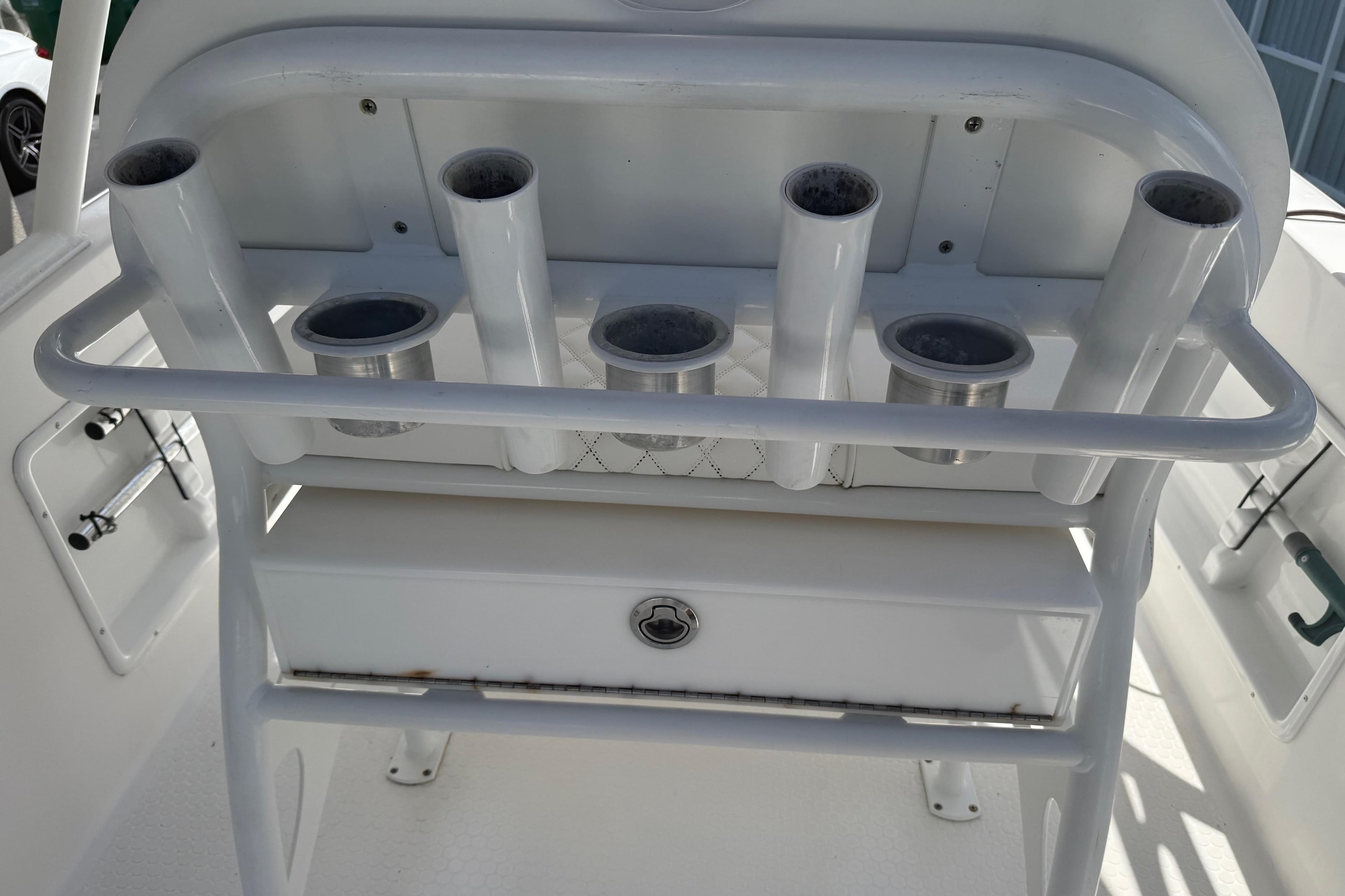 White fishing rod holders on a Concept 27 boat, model year 2015.