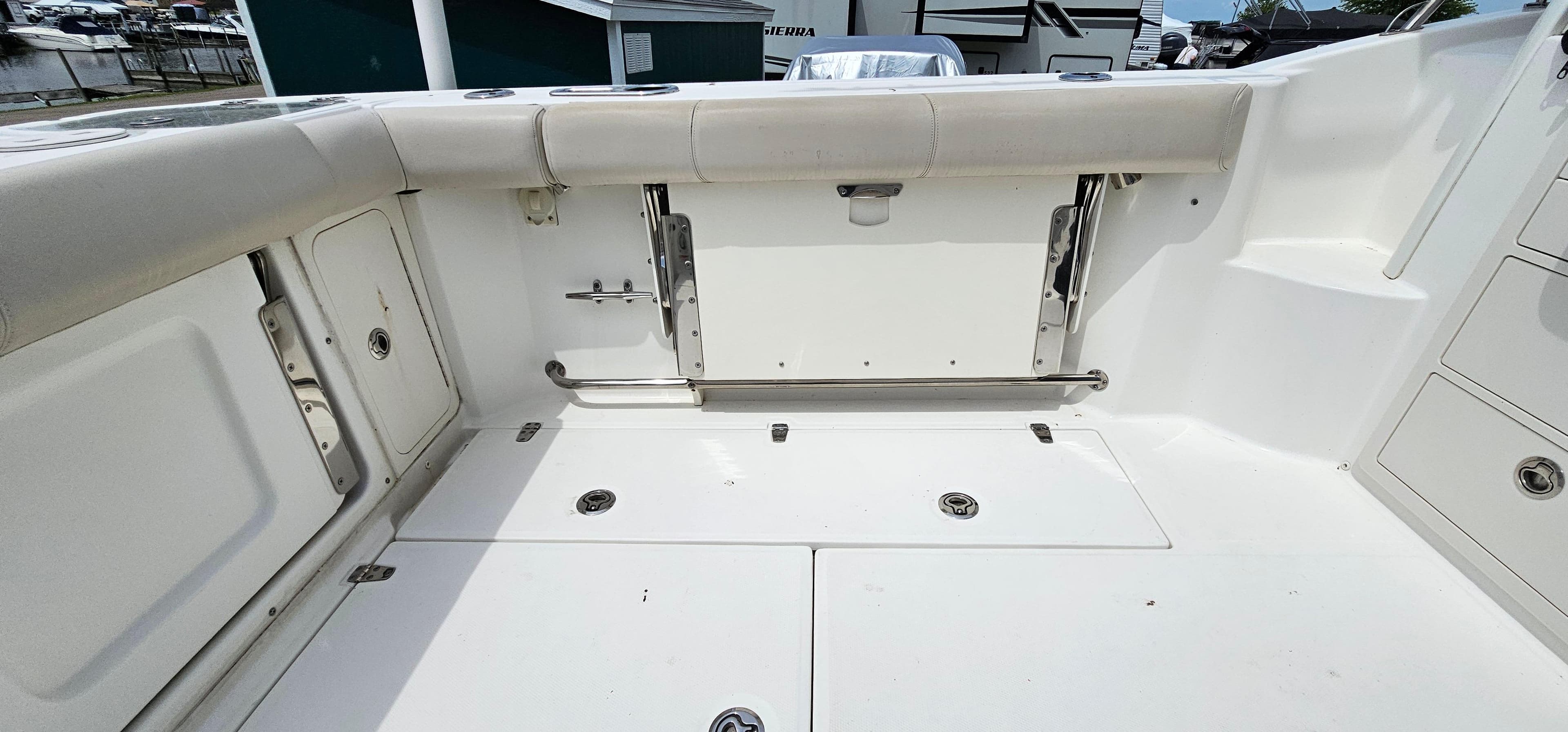 2016 Boston Whaler 285 Conquest boat deck with storage compartments and seating.