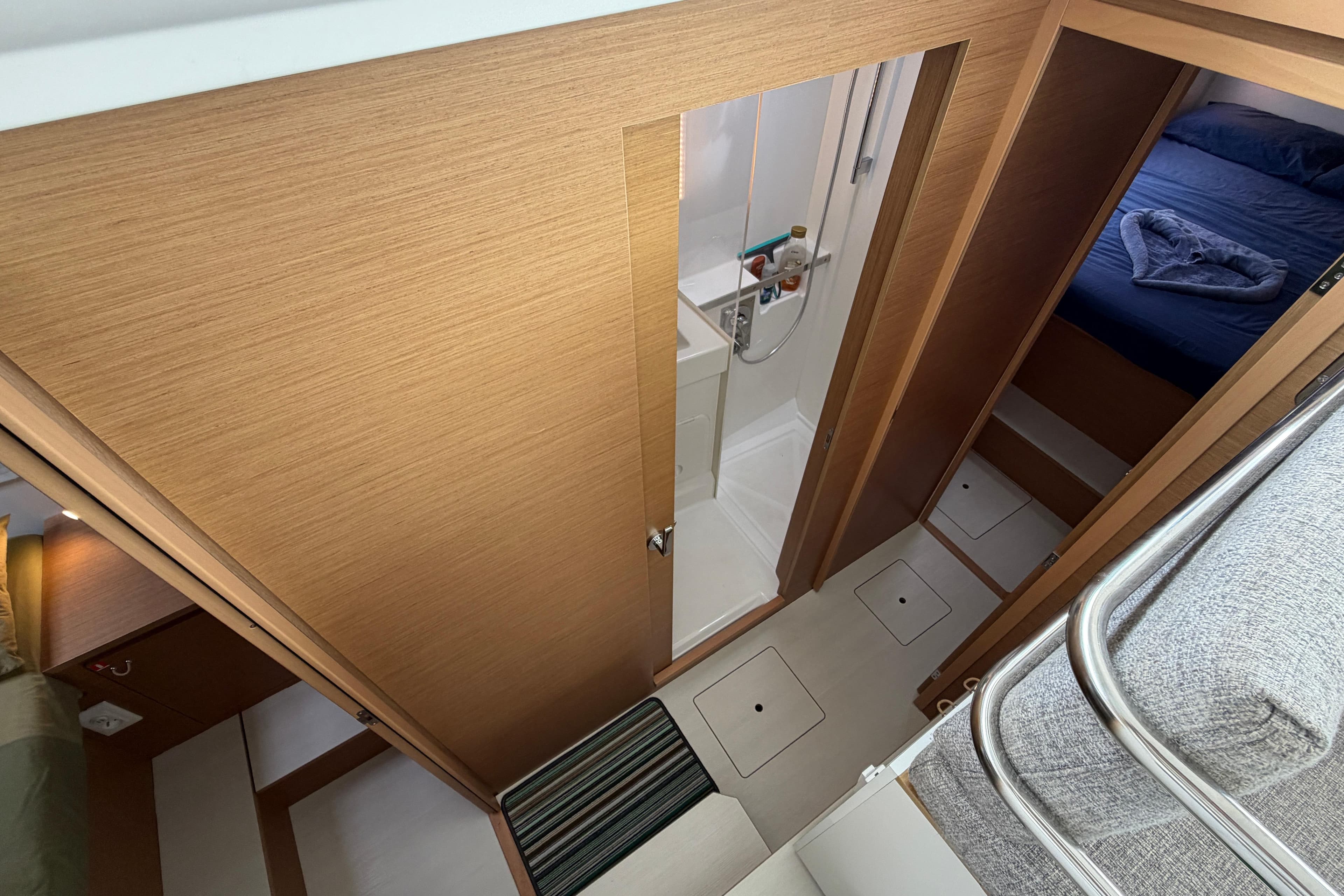2024 Excess 11 yacht interior with bathroom and cozy bedroom.