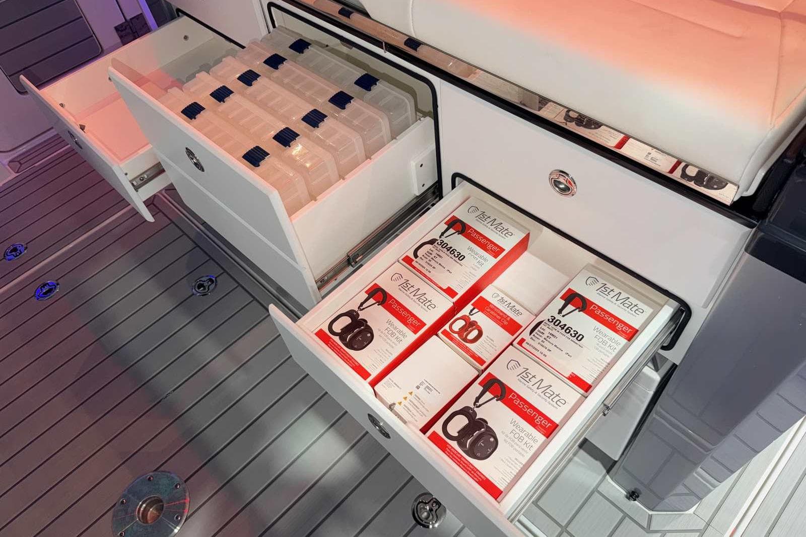 2025 Formula 387 Center Console Fish boat with organized storage drawers and safety equipment.