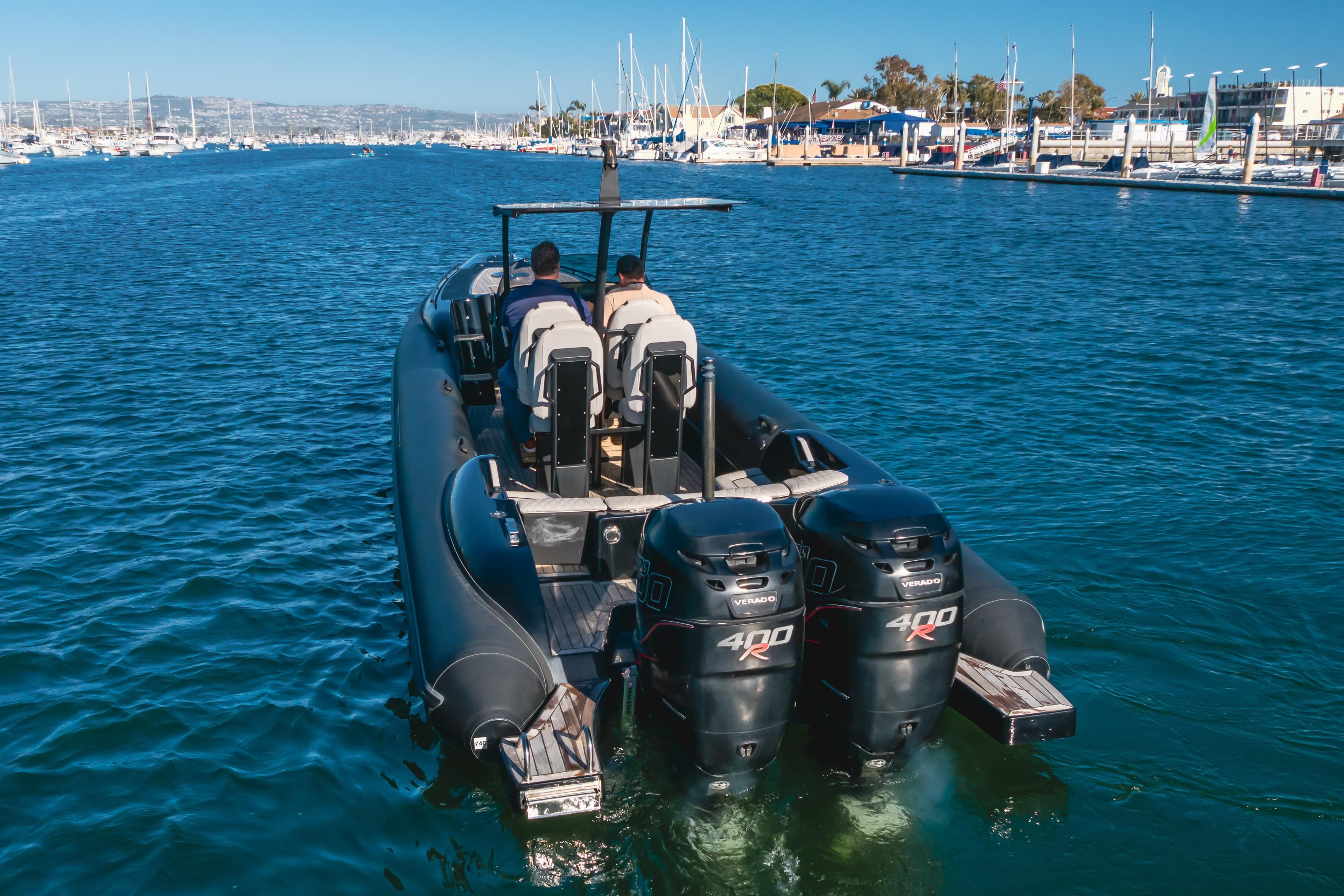 2019 Technohull Sea DNA 999 boat with dual 400R engines in a marina setting.