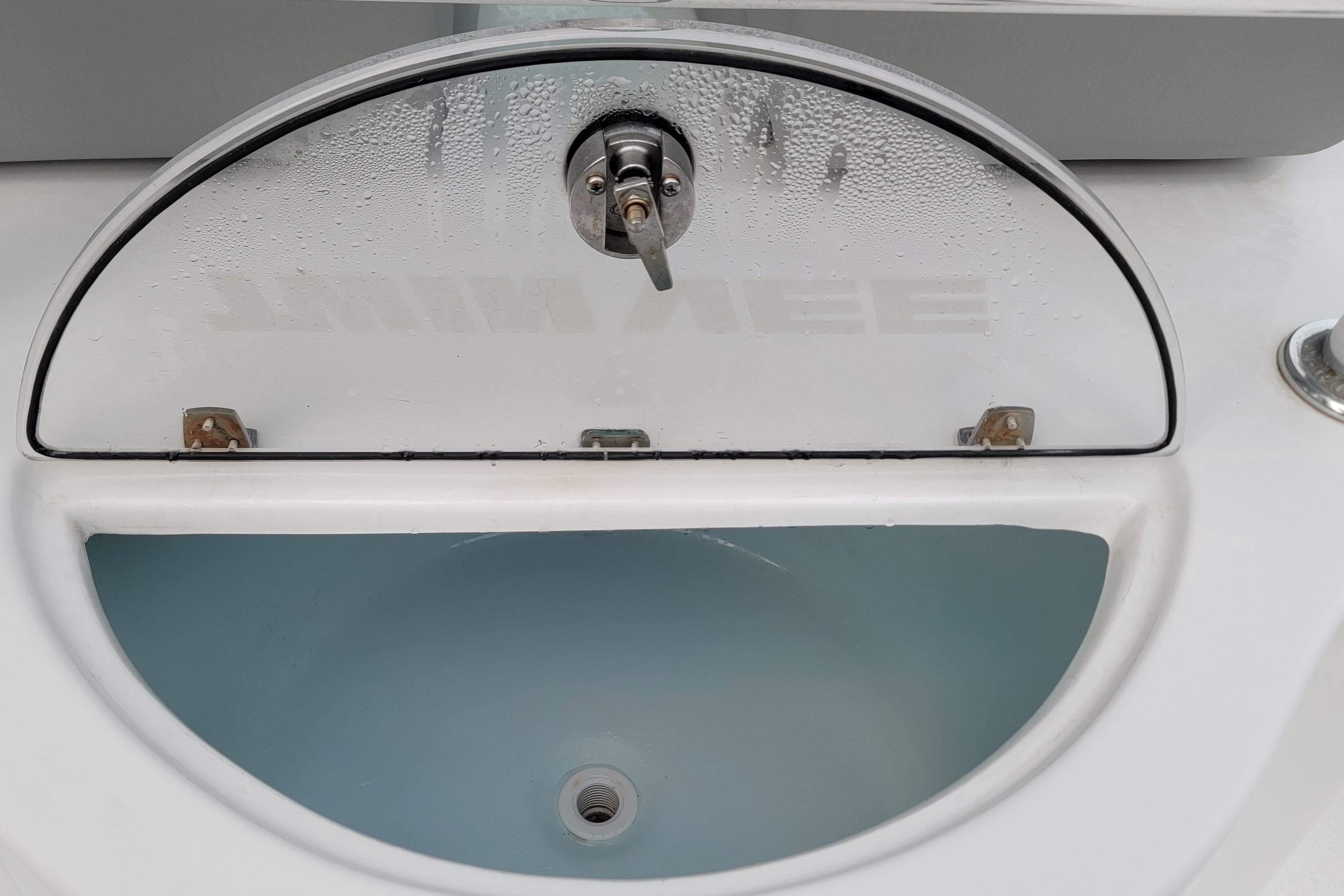 Livewell on 2023 Twin Vee 260 CC GF boat, featuring a clear lid with condensation.