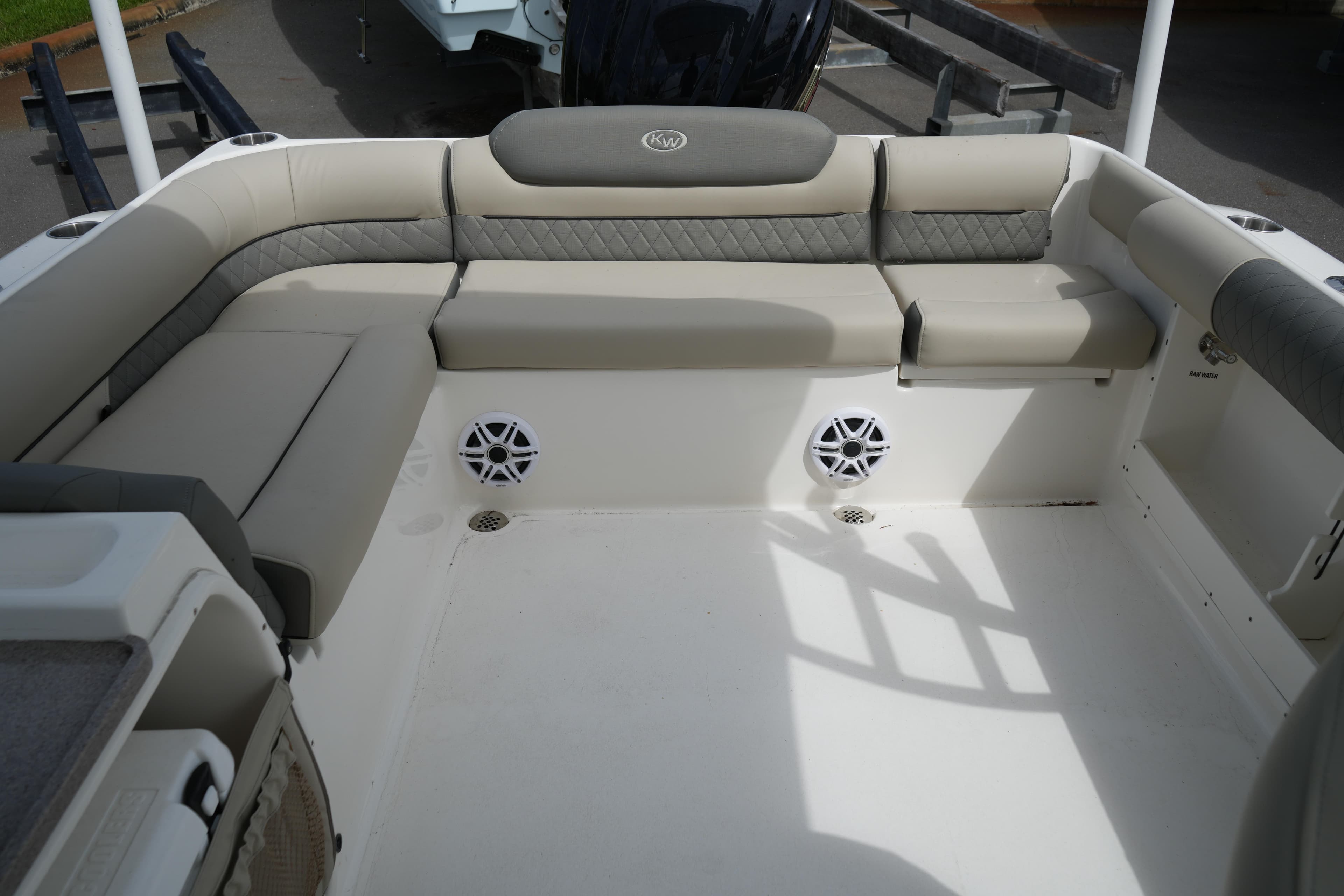 2026 Key West 239 DFS boat interior with cushioned seating and built-in speakers.