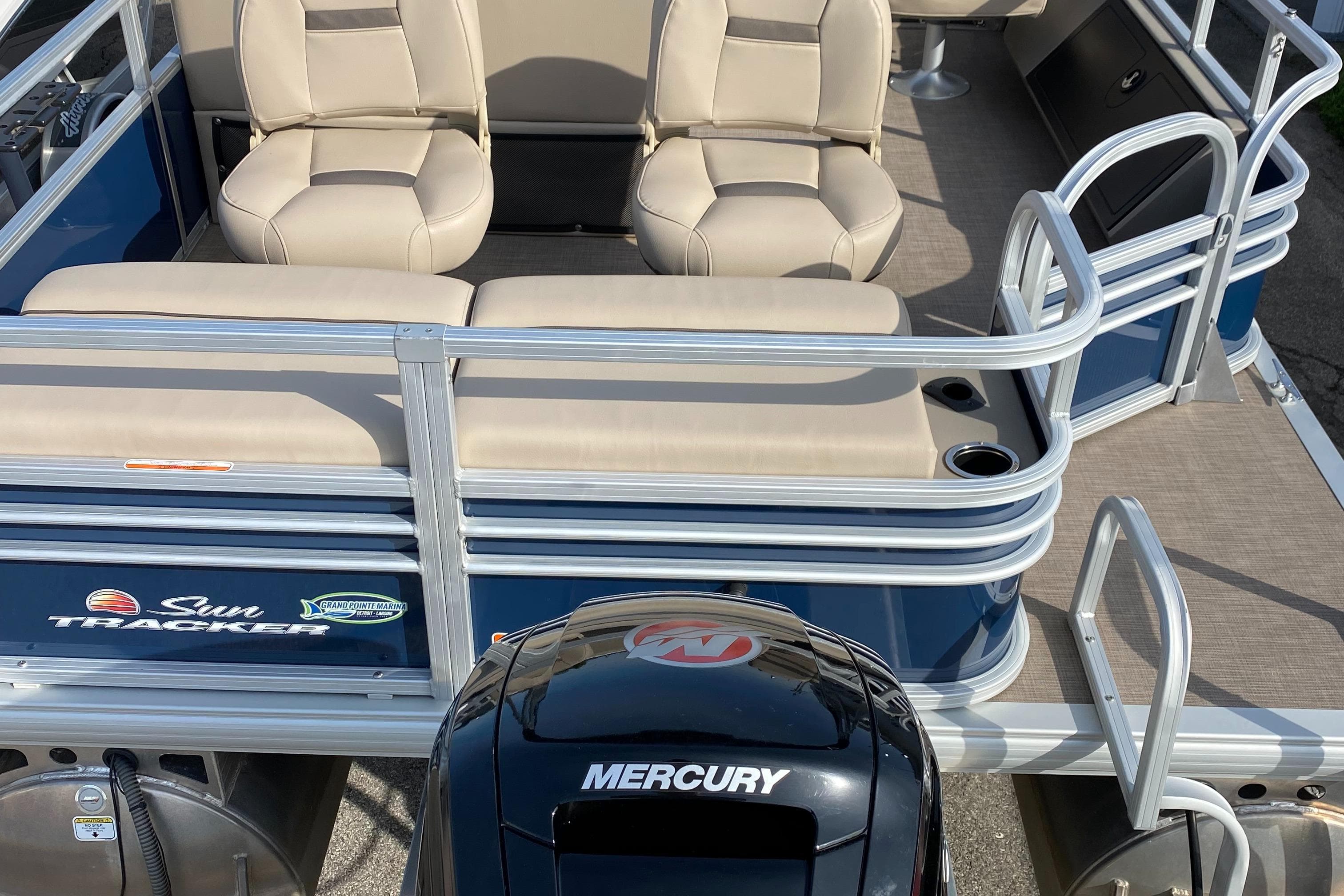 2020 Sun Tracker SportFish 22 DLX pontoon boat with Mercury outboard motor.