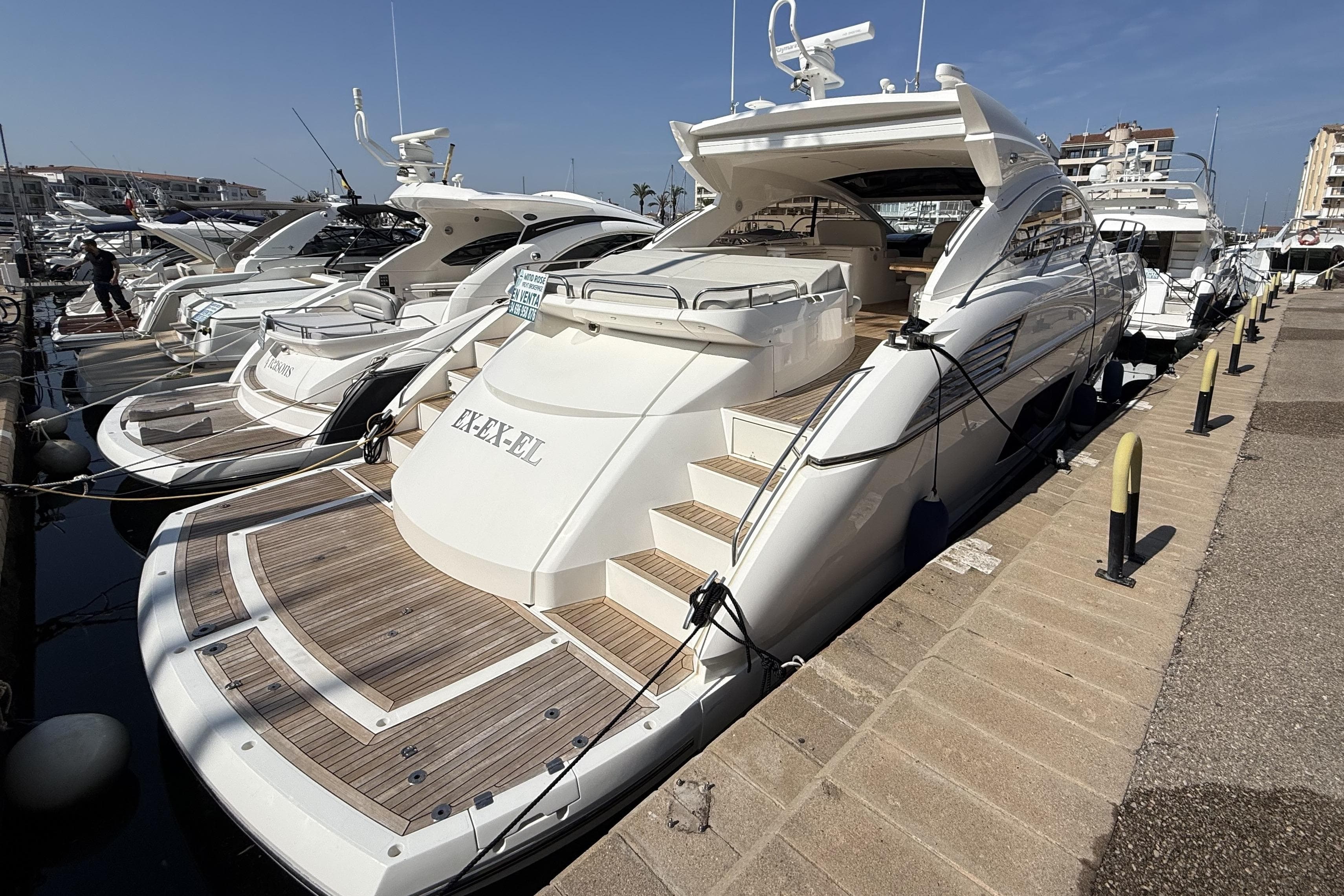 Luxury Sunseeker Predator 60 yacht docked, 2012 model, showcasing sleek design and elegance.