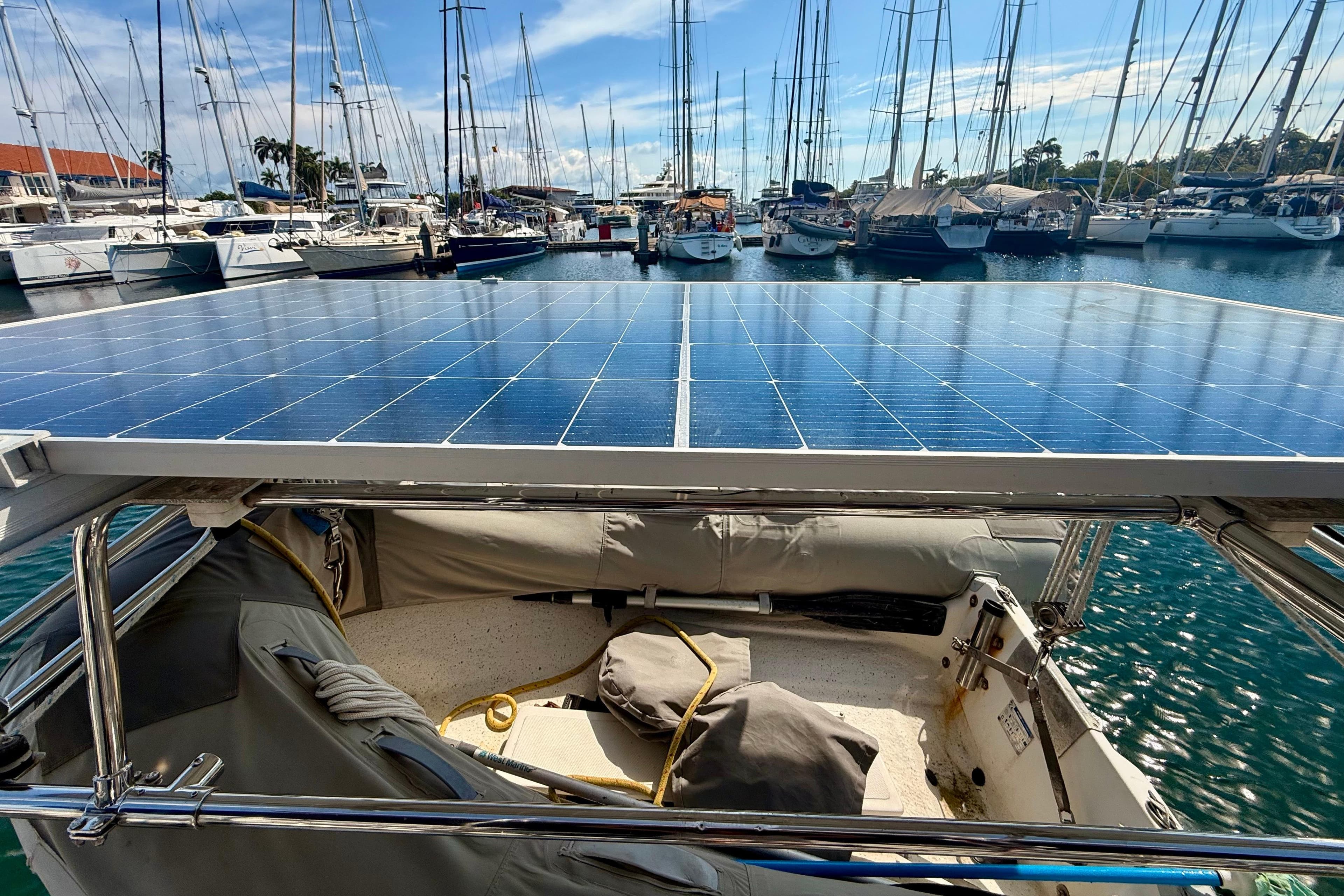 Hunter 376 sailboat with solar panels docked in a marina, 1996 model.