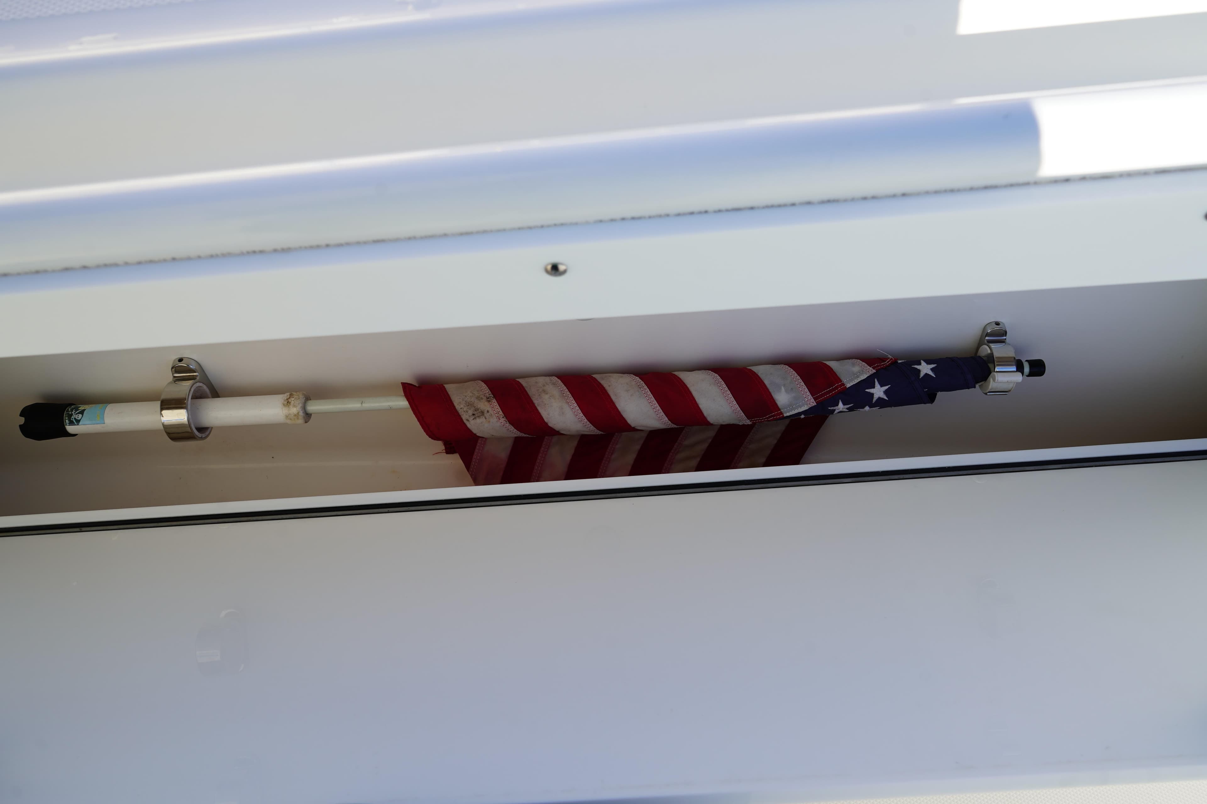 American flag stored in a compartment on a 2021 Edgewater 320CC boat.