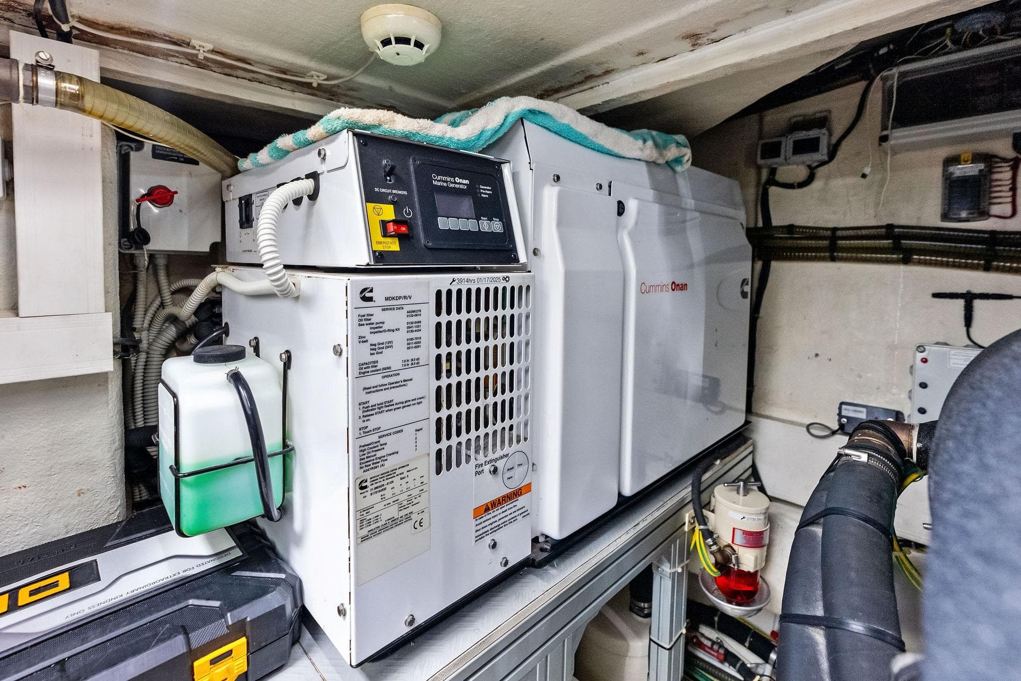 Engine room of 2018 Ferretti Yachts 550 featuring Cummins Onan generator.