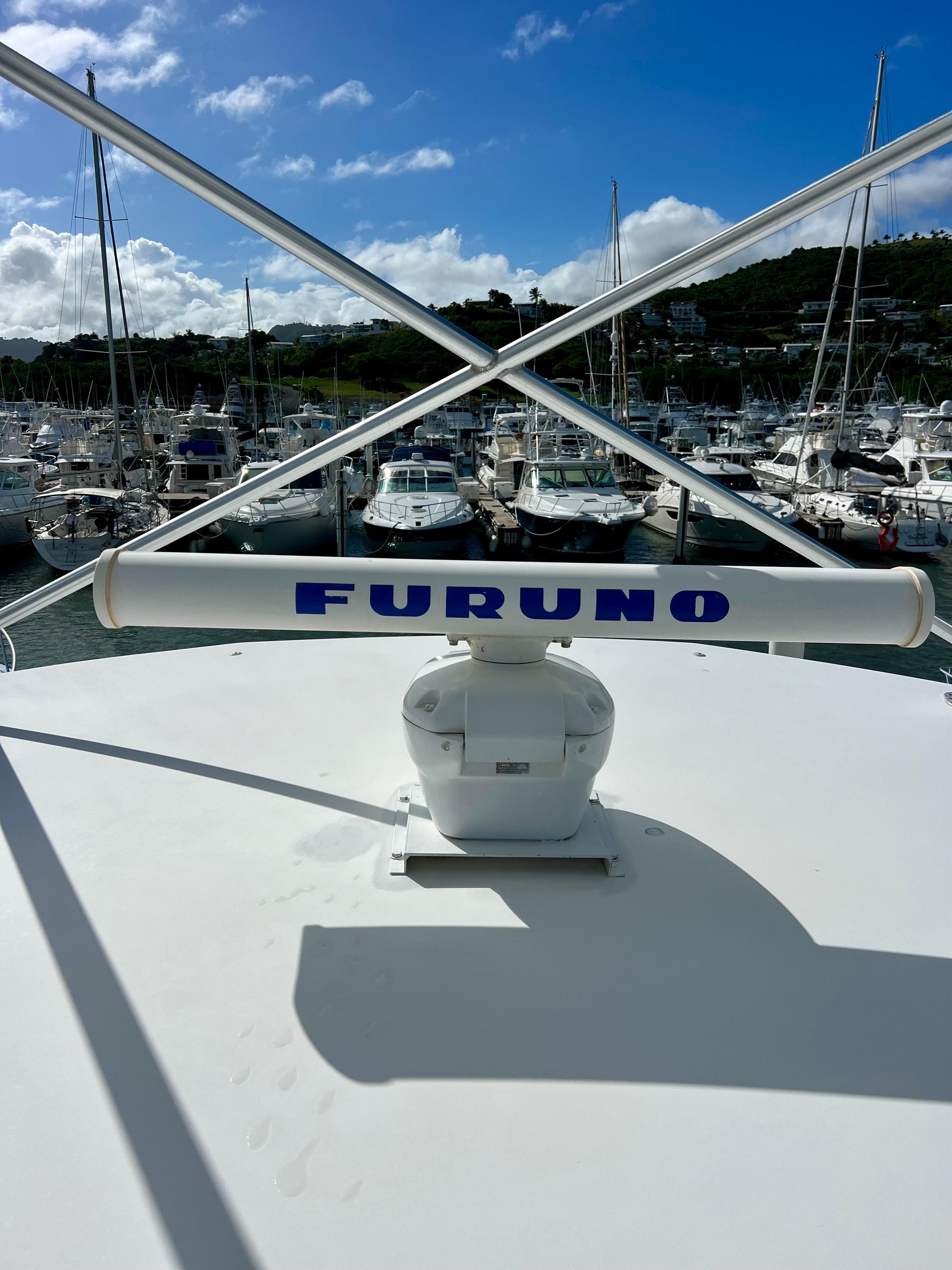 Radar equipment on a 1997 Viking 43 Convertible yacht docked at a marina.