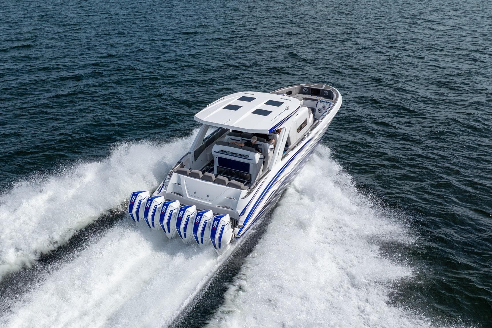 2027 Deep Impact 449 Sport boat cruising on open water with powerful engines.