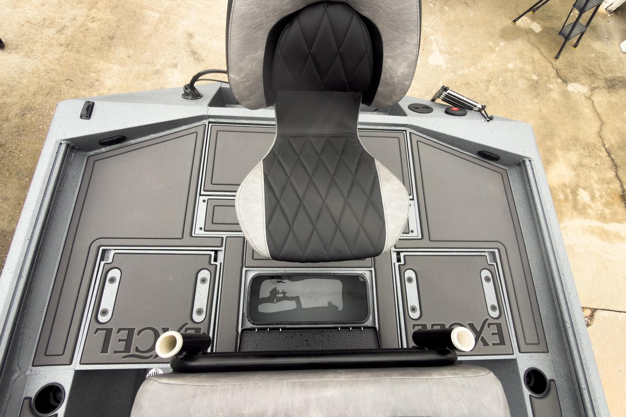 2026 Excel Bay Pro Elite 230 boat deck with seating and storage compartments.