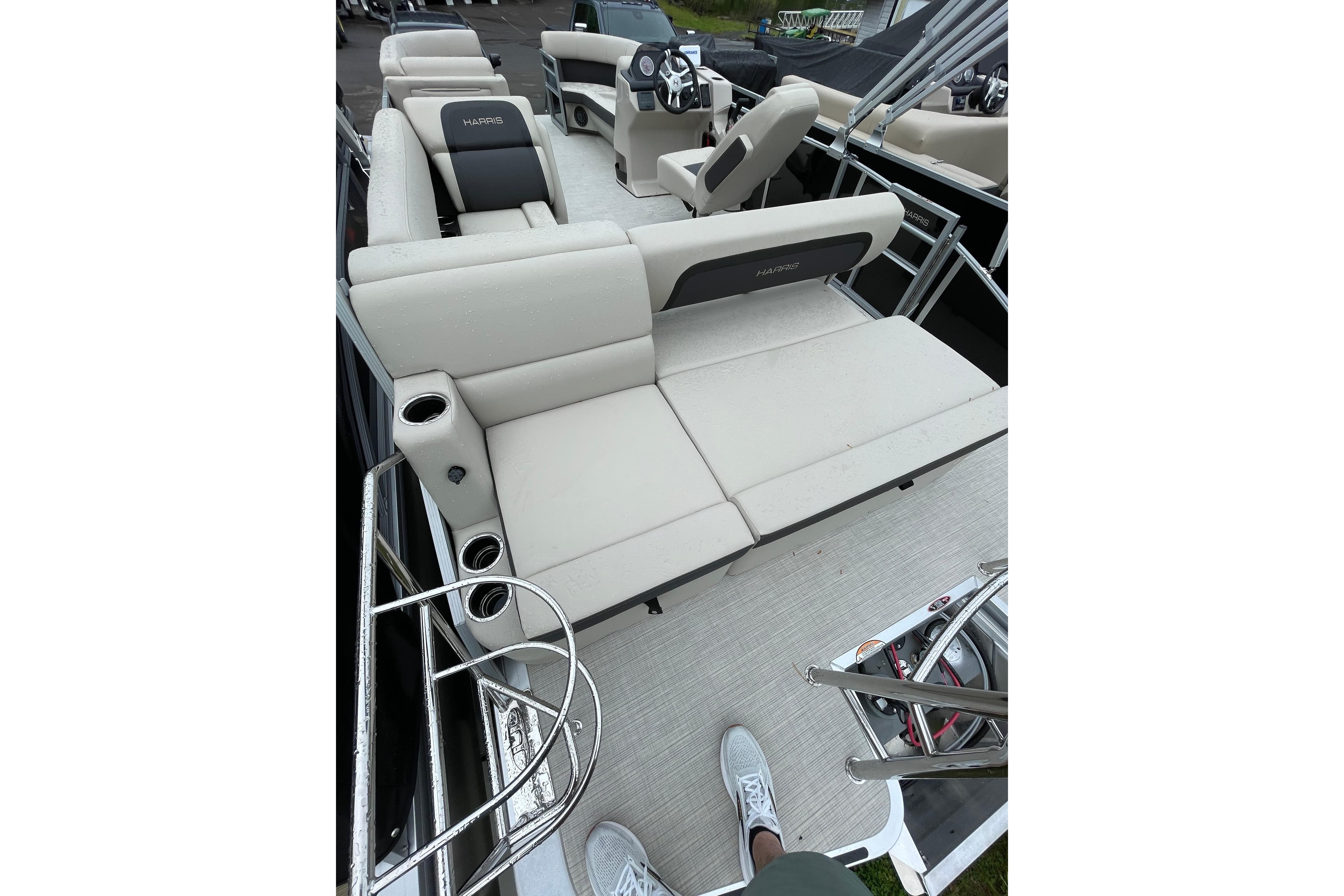 2026 Harris Cruiser 230 SL pontoon boat interior with plush seating and modern design.